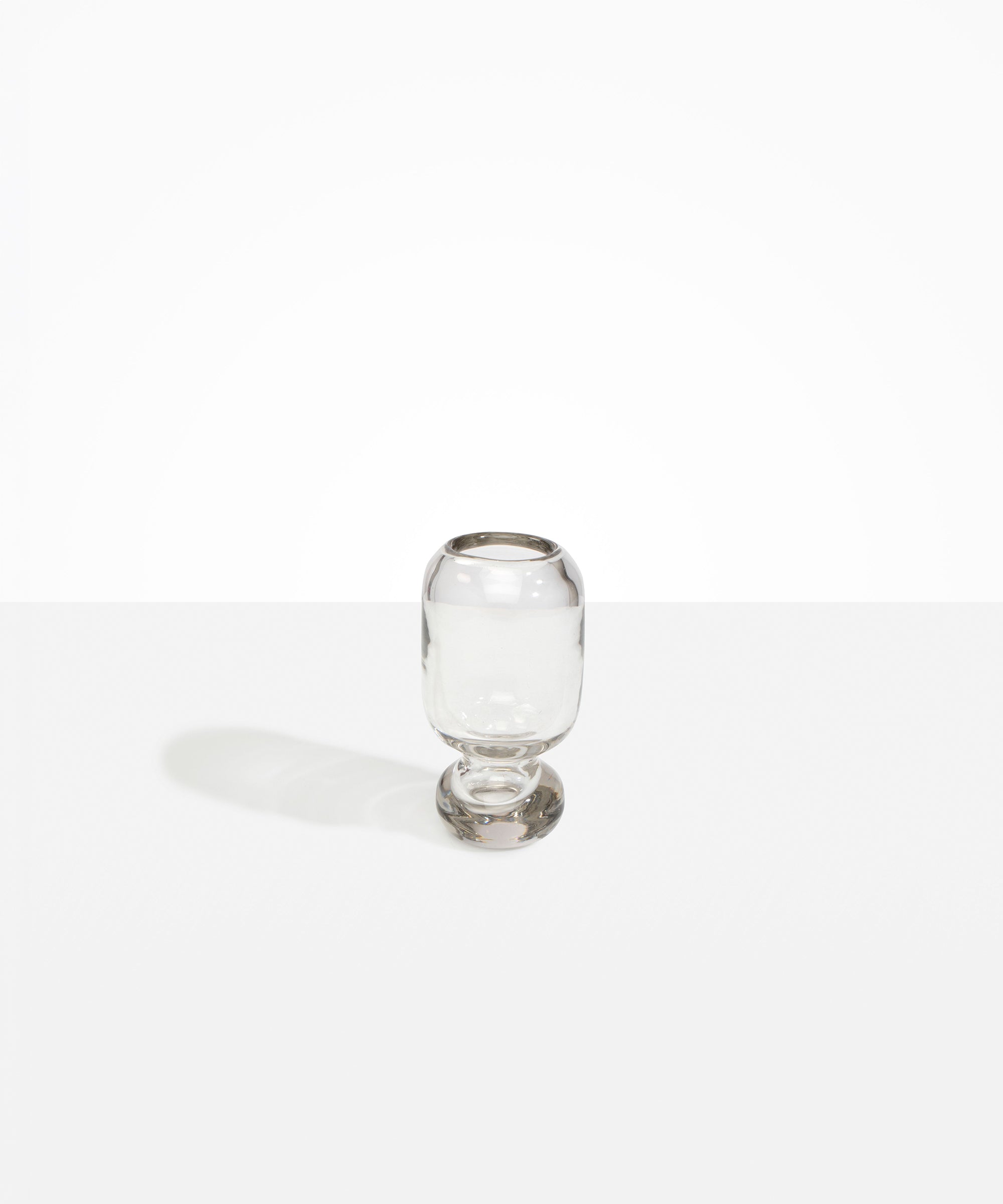 Dinosaur Designs Small Glass Rockpool Vase in Clear — handblown transparent glass vase with rounded bulbous body and small spherical pedestal base