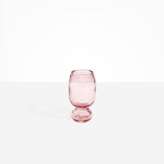 Dinosaur Designs Small Glass Rockpool Vase in Pink — handblown transparent pink glass vase with rounded bulbous body and small spherical pedestal base