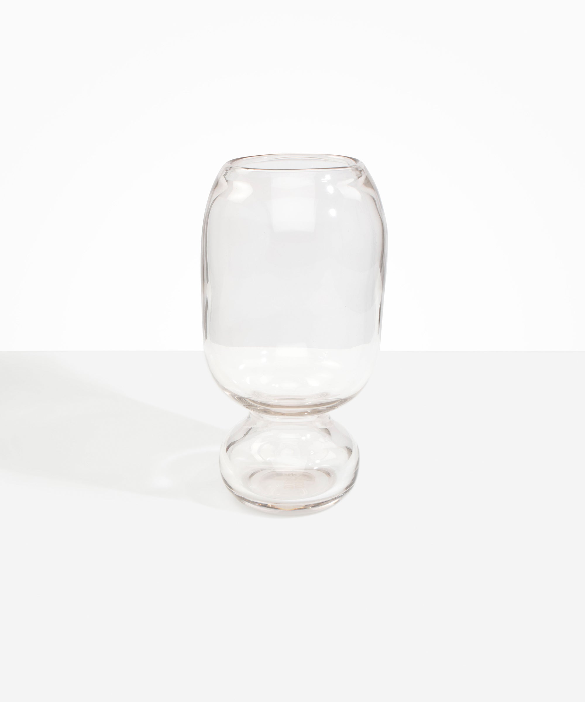 Dinosaur Designs Tall Glass Rockpool Vase in Clear — handblown transparent glass vase with rounded bulbous body and spherical pedestal base