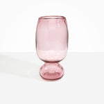 Dinosaur Designs Tall Glass Rockpool Vase in Pink — handblown transparent pink glass vase with rounded bulbous body and spherical pedestal base