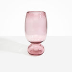 Dinosaur Designs Tall Glass Rockpool Vase in Pink — handblown transparent pink glass vase with rounded bulbous body and spherical pedestal base