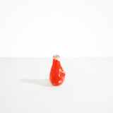 Dinosaur Designs medium sized Liquid vase in daisy red and cream colour resin..