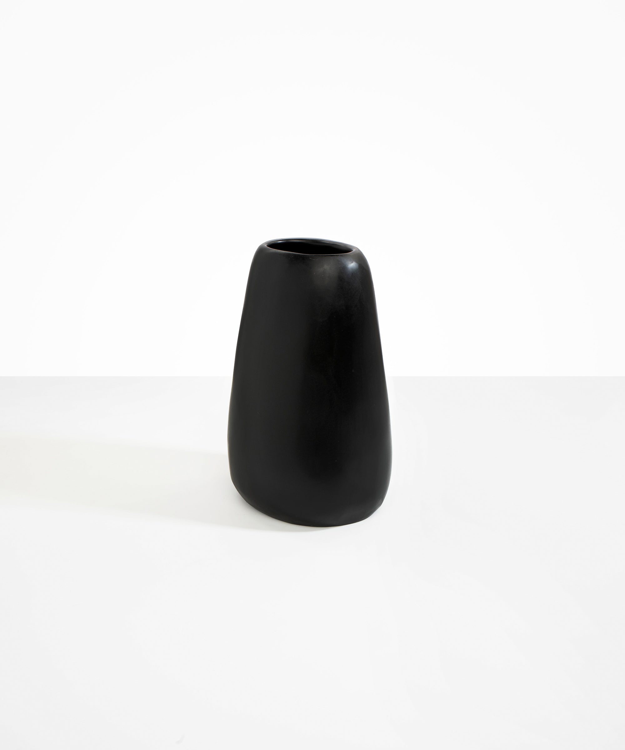 Dinosaur Designs Large Pebble Vase in Black — handcrafted black resin vase with smooth rounded pebble form and narrow opening