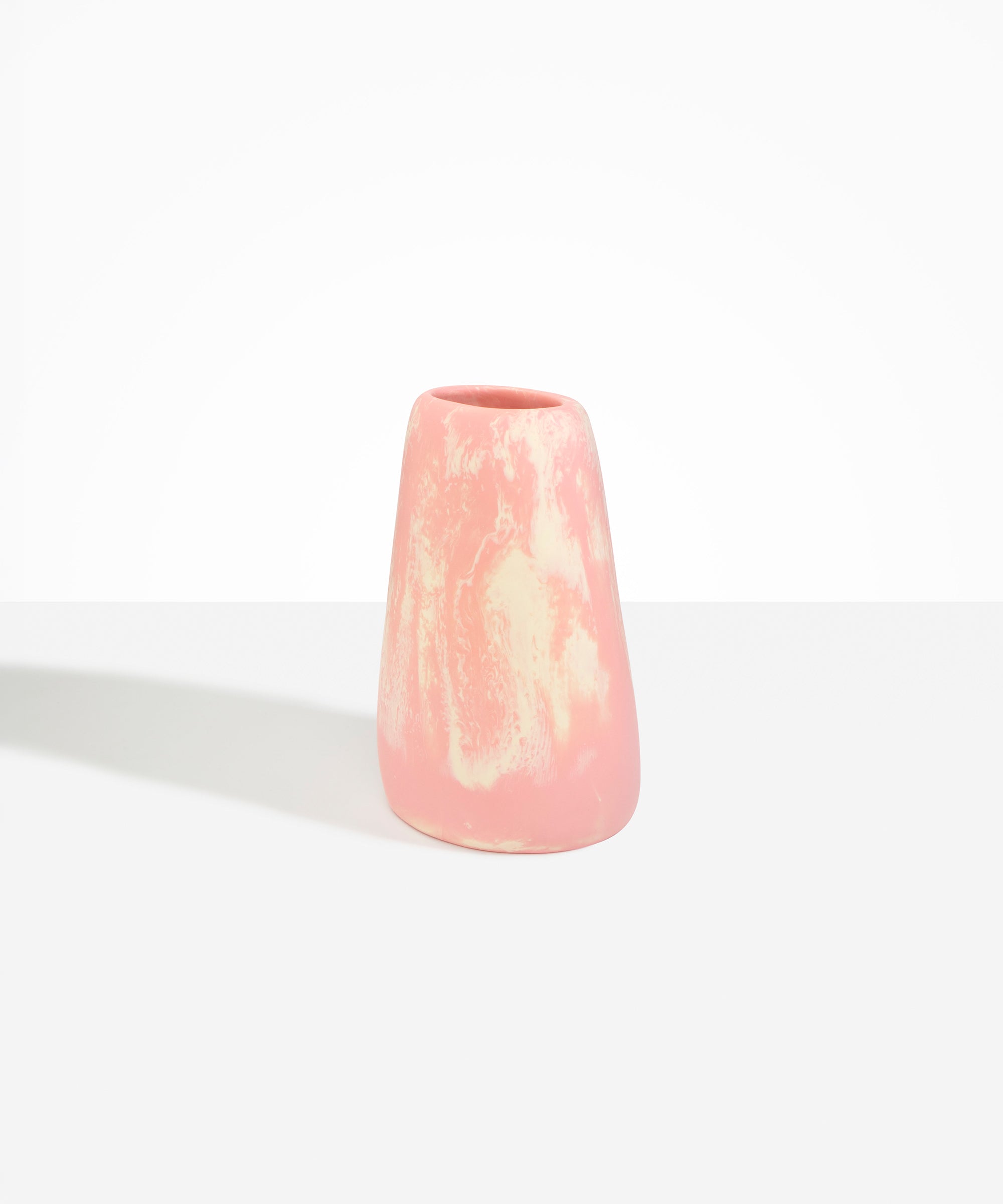 Dinosaur Designs Large Pebble Vase in Blossom — handcrafted marbled pink and cream resin vase with smooth rounded pebble form and narrow opening