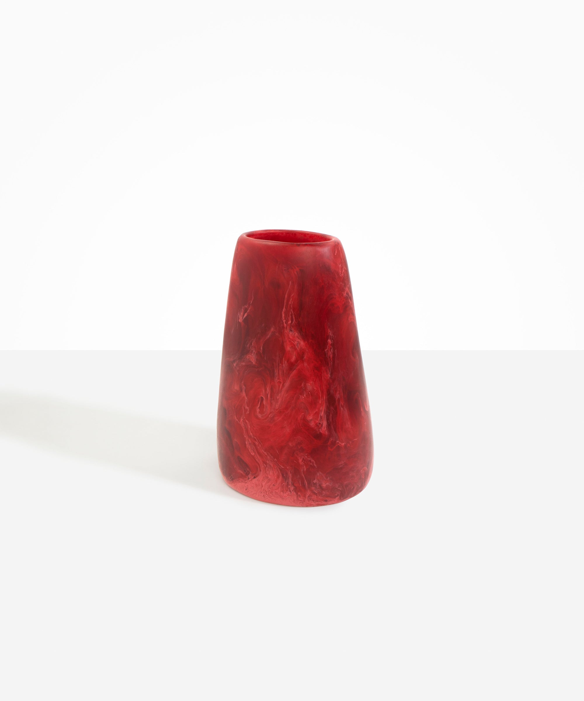 Dinosaur Designs Large Pebble Vase in Cranberry — handcrafted marbled red and transparent resin vase with smooth rounded pebble form and narrow opening
