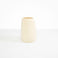 Dinosaur Designs Large Pebble Vase in Cream — handcrafted cream resin vase with smooth rounded pebble form and narrow opening