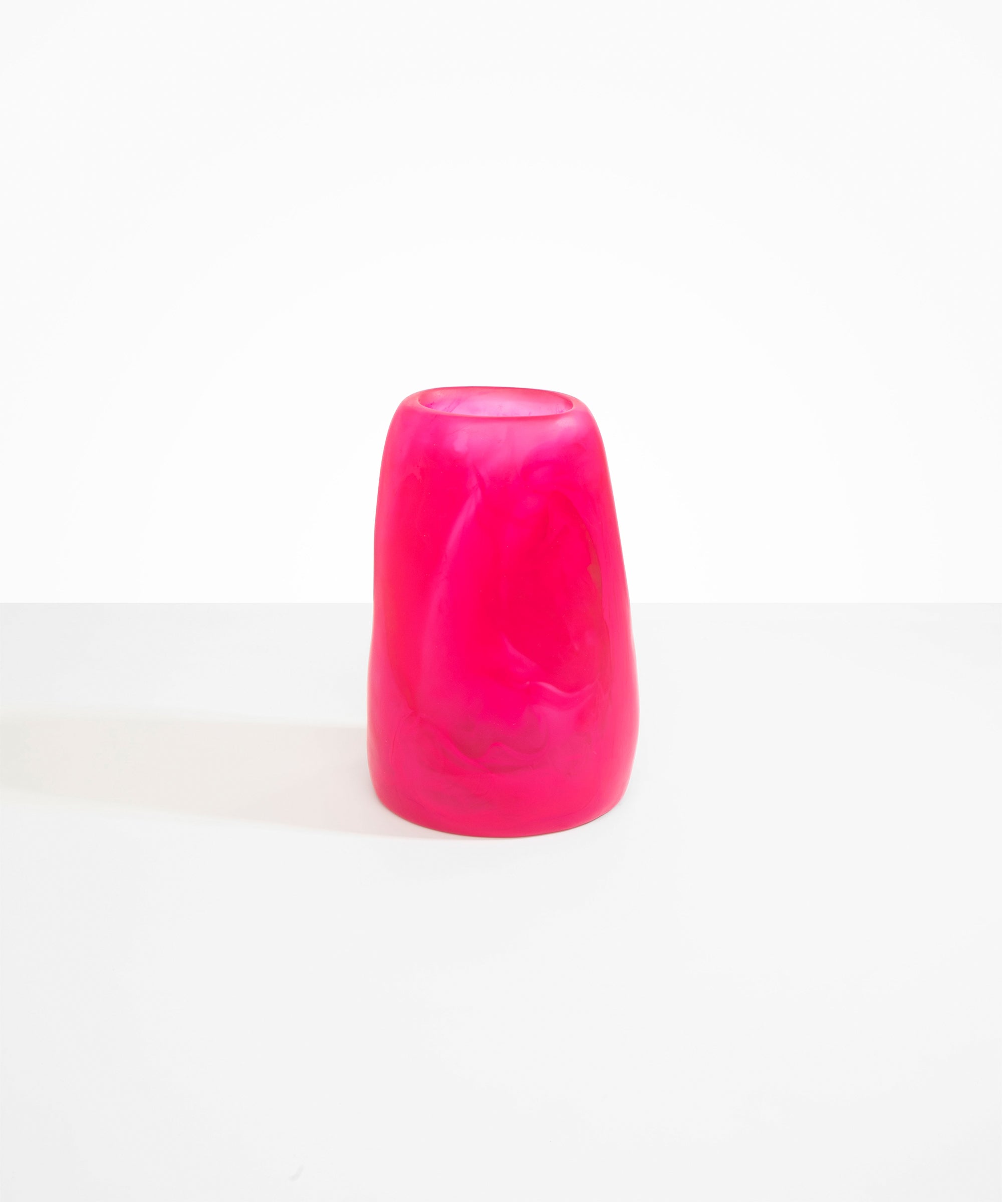Dinosaur Designs Large Pebble Vase in Flamingo — handcrafted marbled pink and transparent resin vase with smooth rounded pebble form and narrow opening