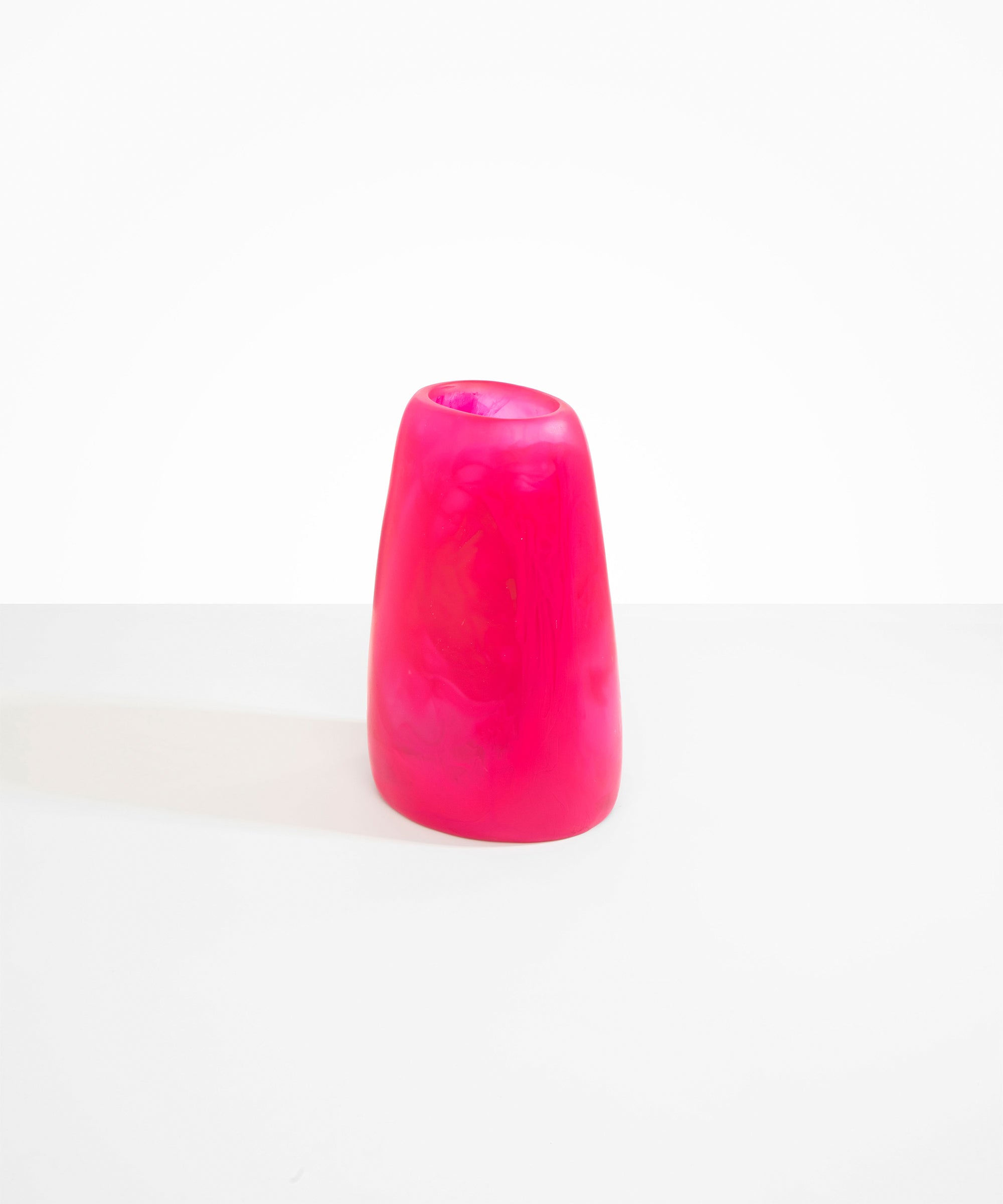 Dinosaur Designs Large Pebble Vase in Flamingo — handcrafted marbled pink and transparent resin vase with smooth rounded pebble form and narrow opening