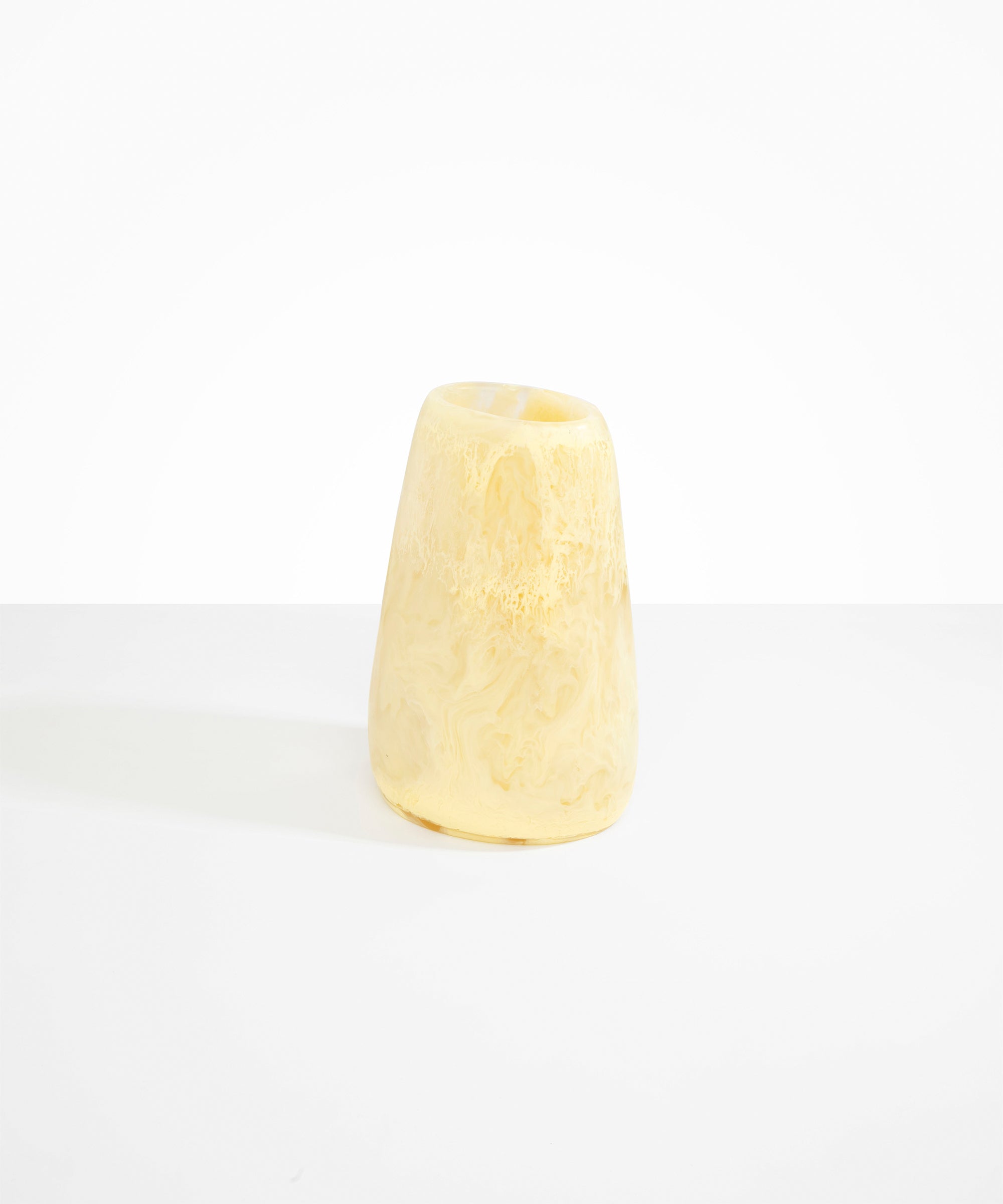 Dinosaur Designs Large Pebble Vase in Lemon — handcrafted marbled yellow and transparent resin vase with smooth rounded pebble form and narrow opening