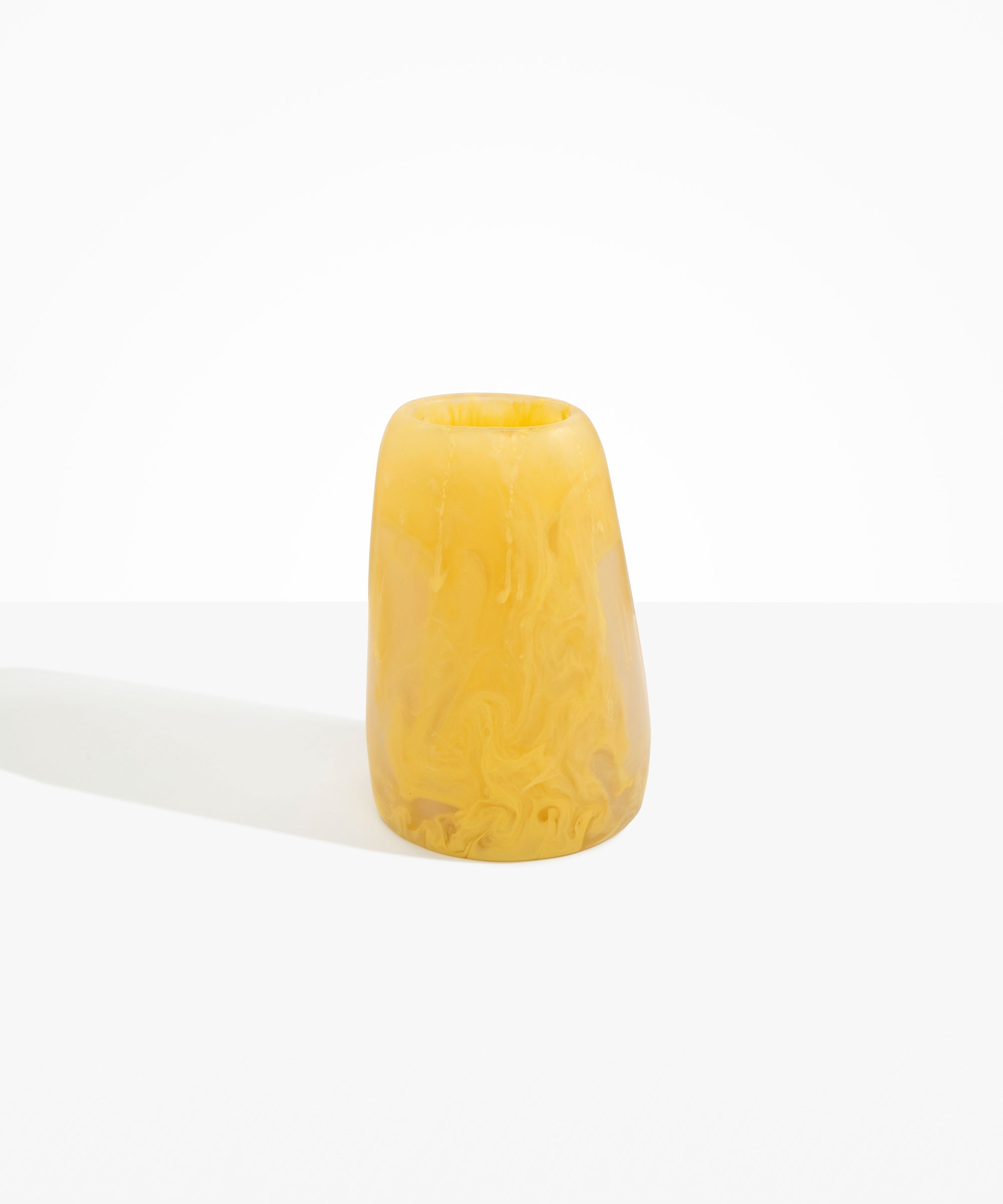 Dinosaur Designs Large Pebble Vase in Pollen — handcrafted marbled yellow and transparent resin vase with smooth rounded pebble form and narrow opening