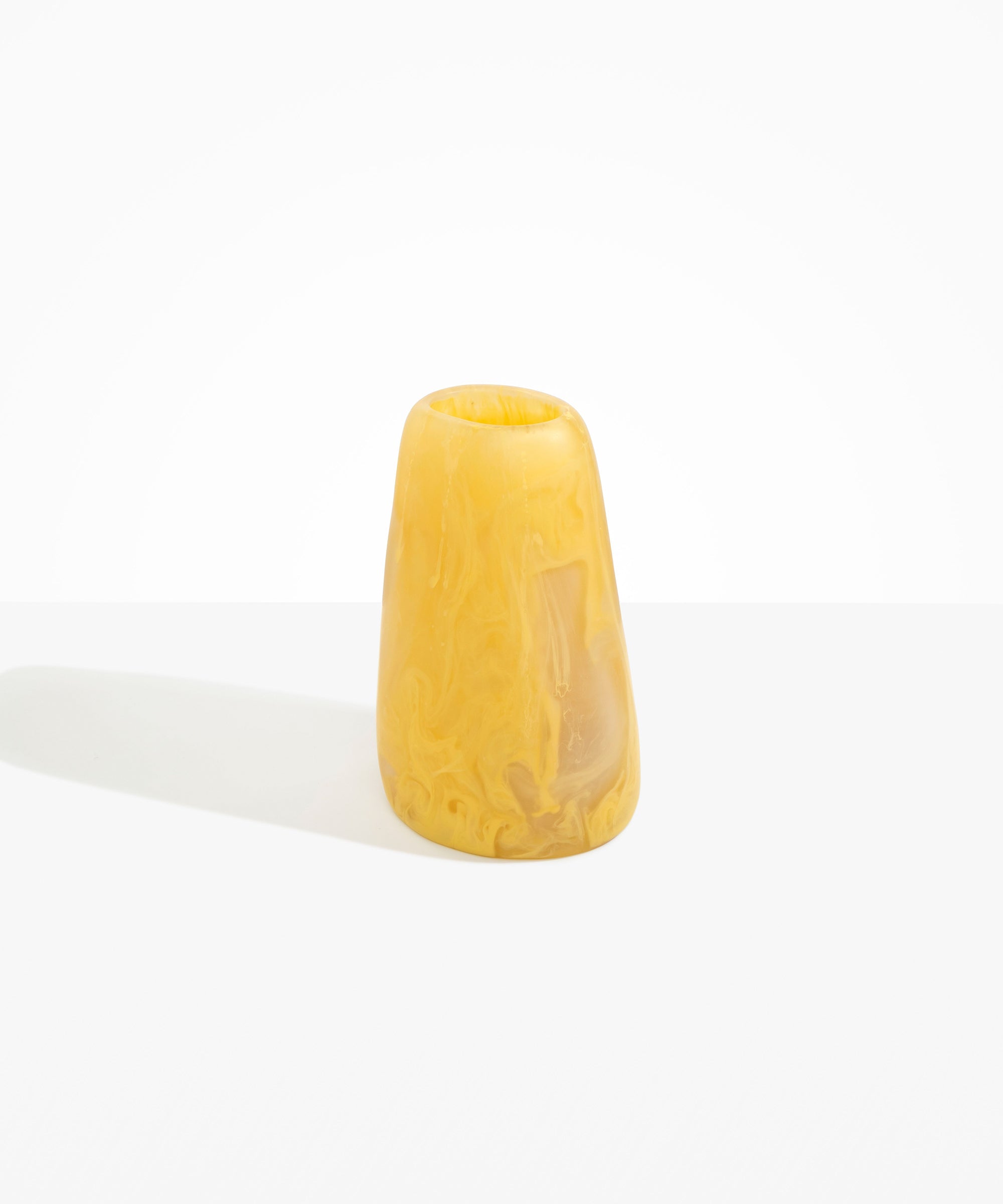 Dinosaur Designs Large Pebble Vase in Pollen — handcrafted marbled yellow and transparent resin vase with smooth rounded pebble form and narrow opening