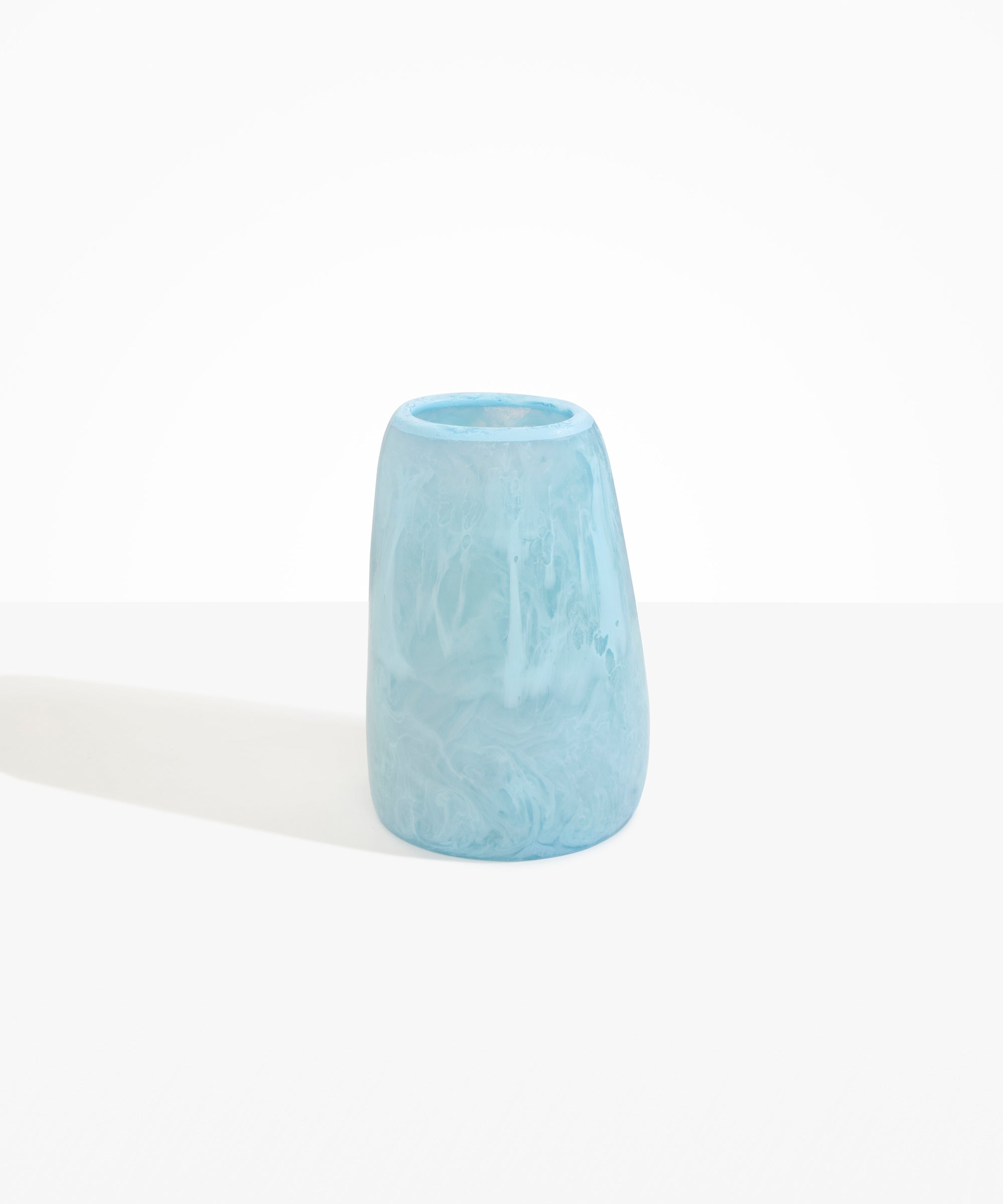 Dinosaur Designs Large Pebble Vase in Pool — handcrafted marbled blue and transparent resin vase with smooth rounded pebble form and narrow opening