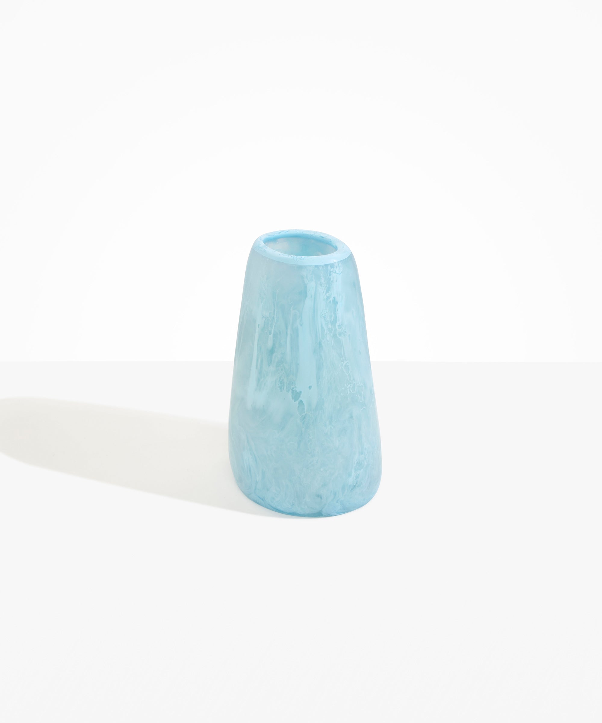 Dinosaur Designs Large Pebble Vase in Pool — handcrafted marbled blue and transparent resin vase with smooth rounded pebble form and narrow opening