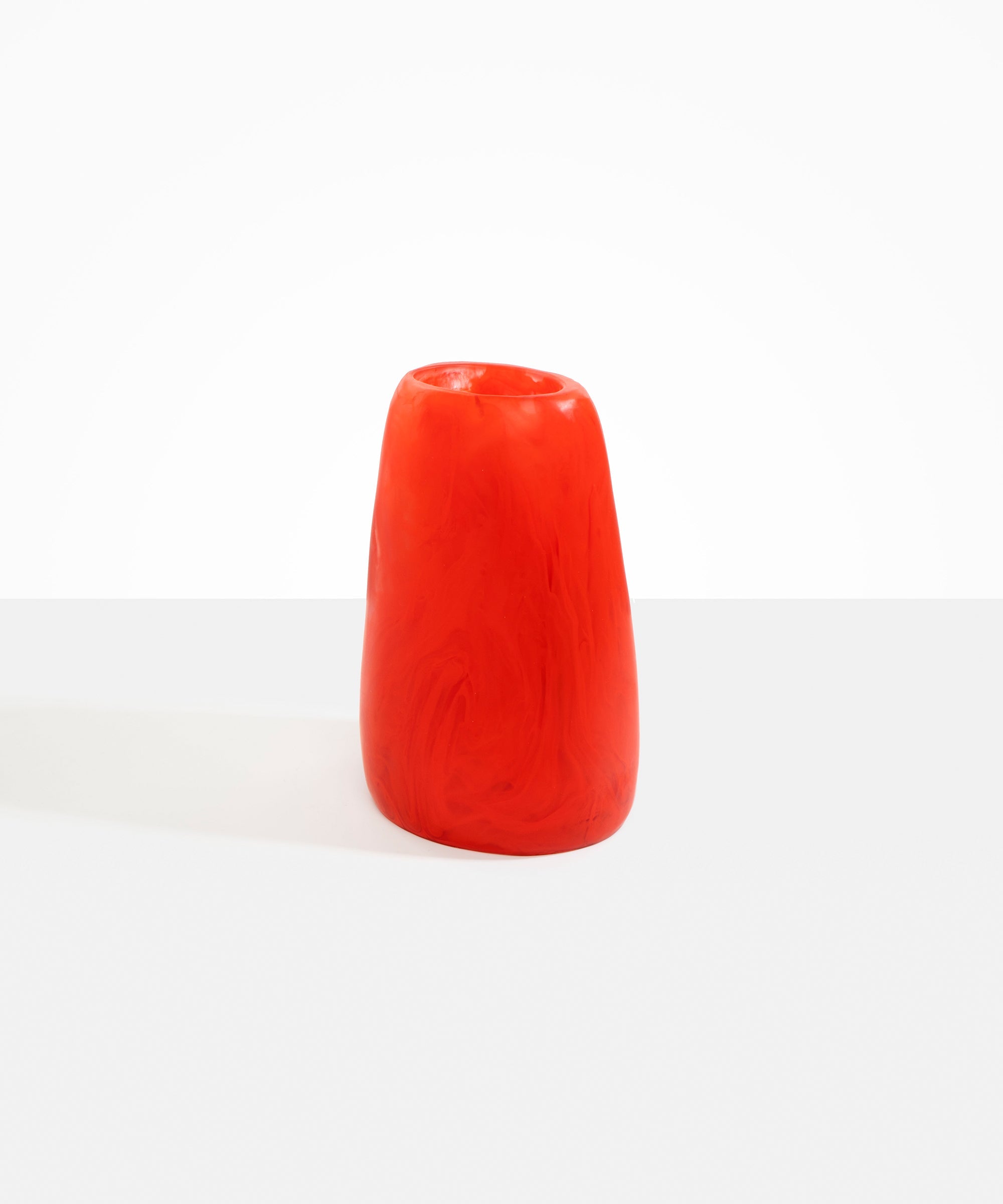 Dinosaur Designs Large Pebble Vase in Poppy — handcrafted marbled red and transparent resin vase with smooth rounded pebble form and narrow opening
