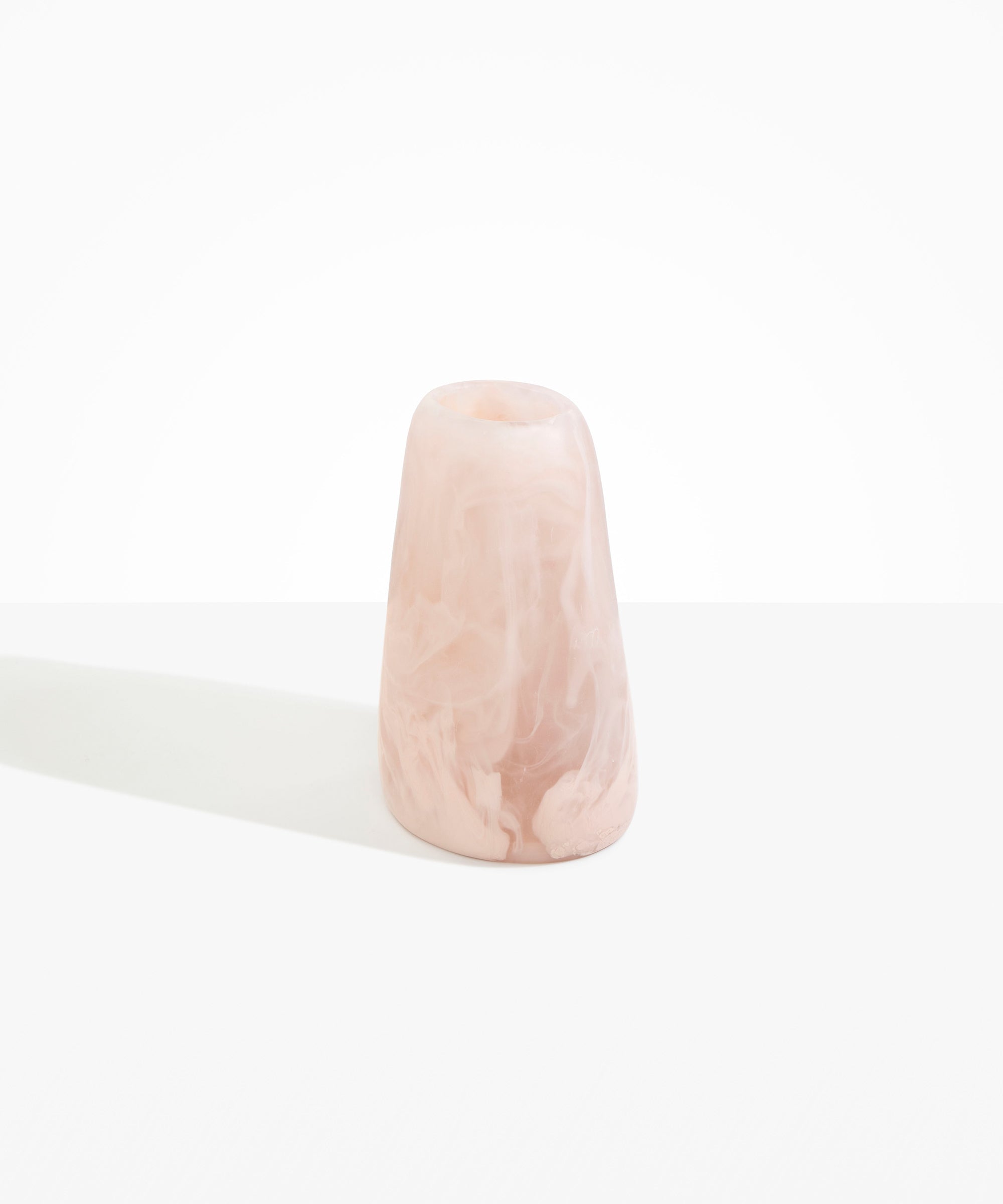 Dinosaur Designs Large Pebble Vase in Rose Swirl — handcrafted marbled pink and transparent resin vase with smooth rounded pebble form and narrow opening.