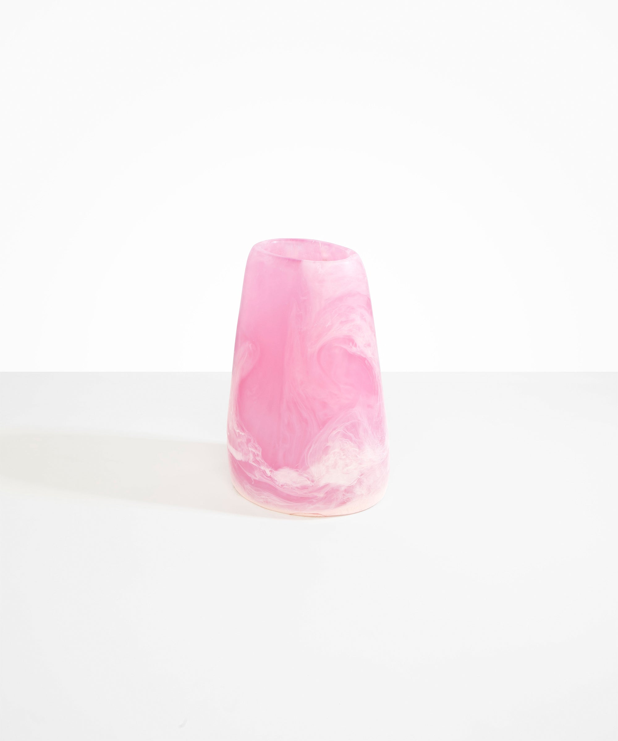 Dinosaur Designs Large Pebble Vase in Shell Pink — handcrafted marbled pink and transparent resin vase with smooth rounded pebble form and narrow opening