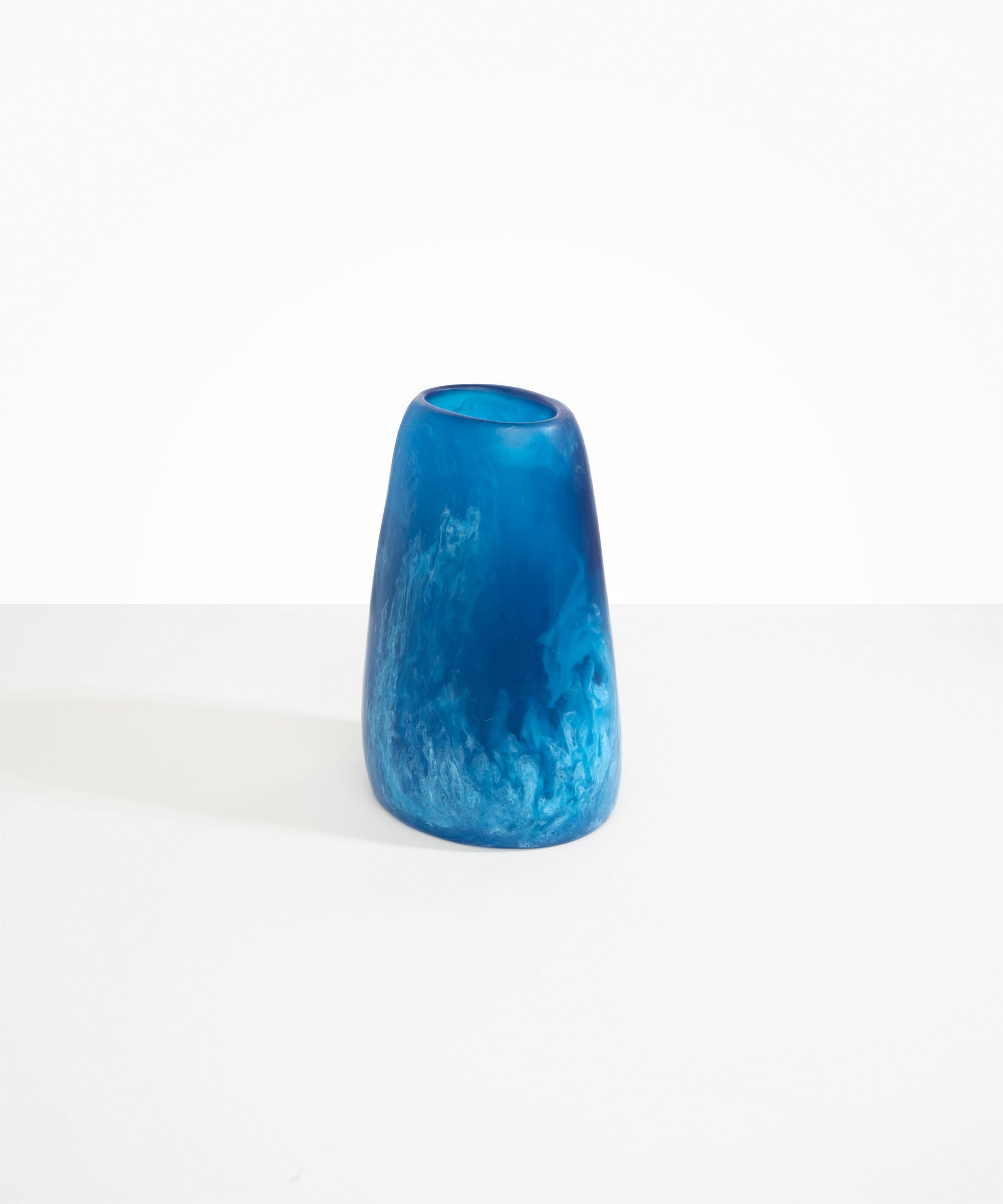 Dinosaur Designs Large Pebble Vase in Sky — handcrafted marbled blue and transparent resin vase with smooth rounded pebble form and narrow opening