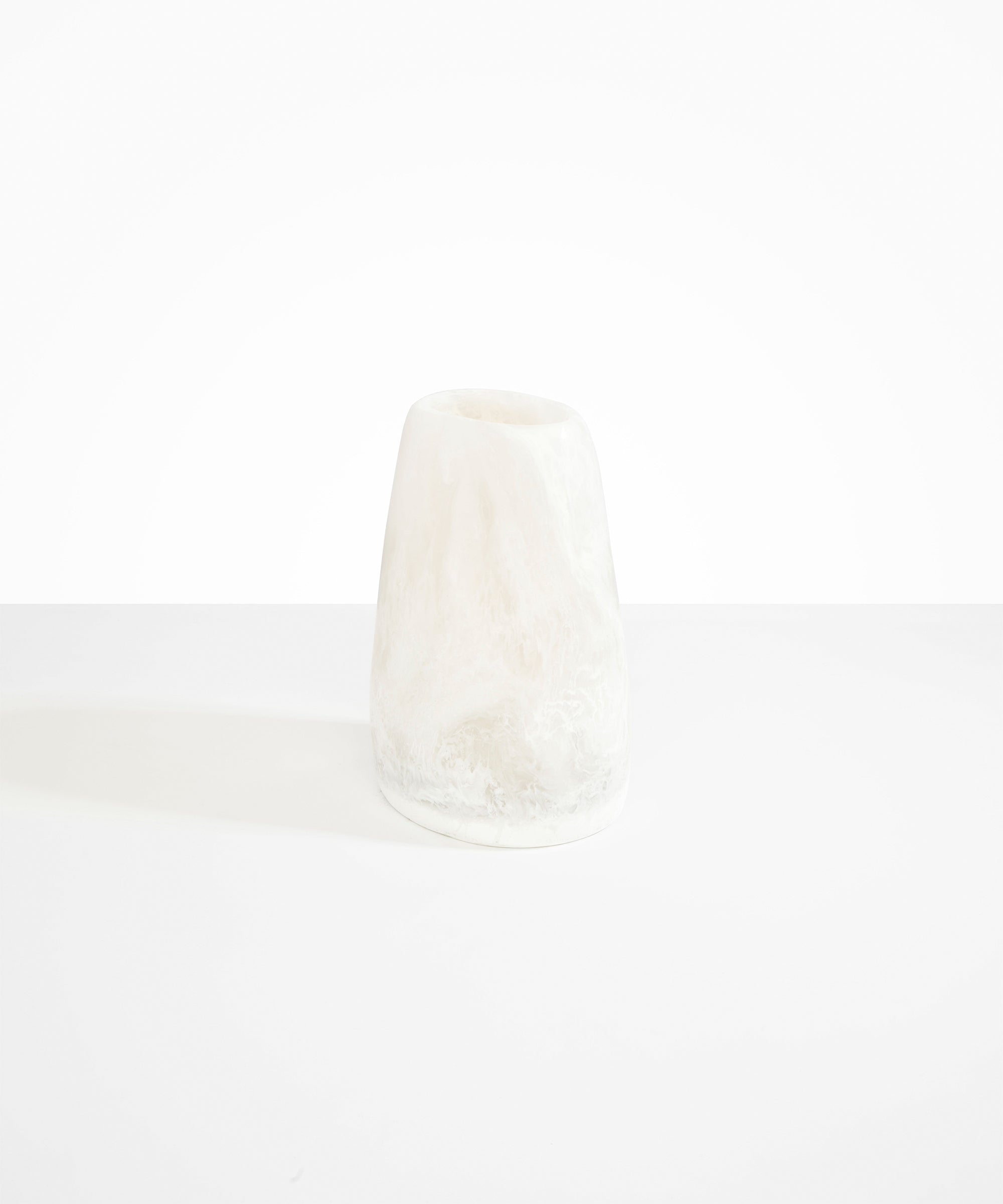 Dinosaur Designs Large Pebble Vase in Snow Swirl — handcrafted marbled white and transparent resin vase with smooth rounded pebble form and narrow opening