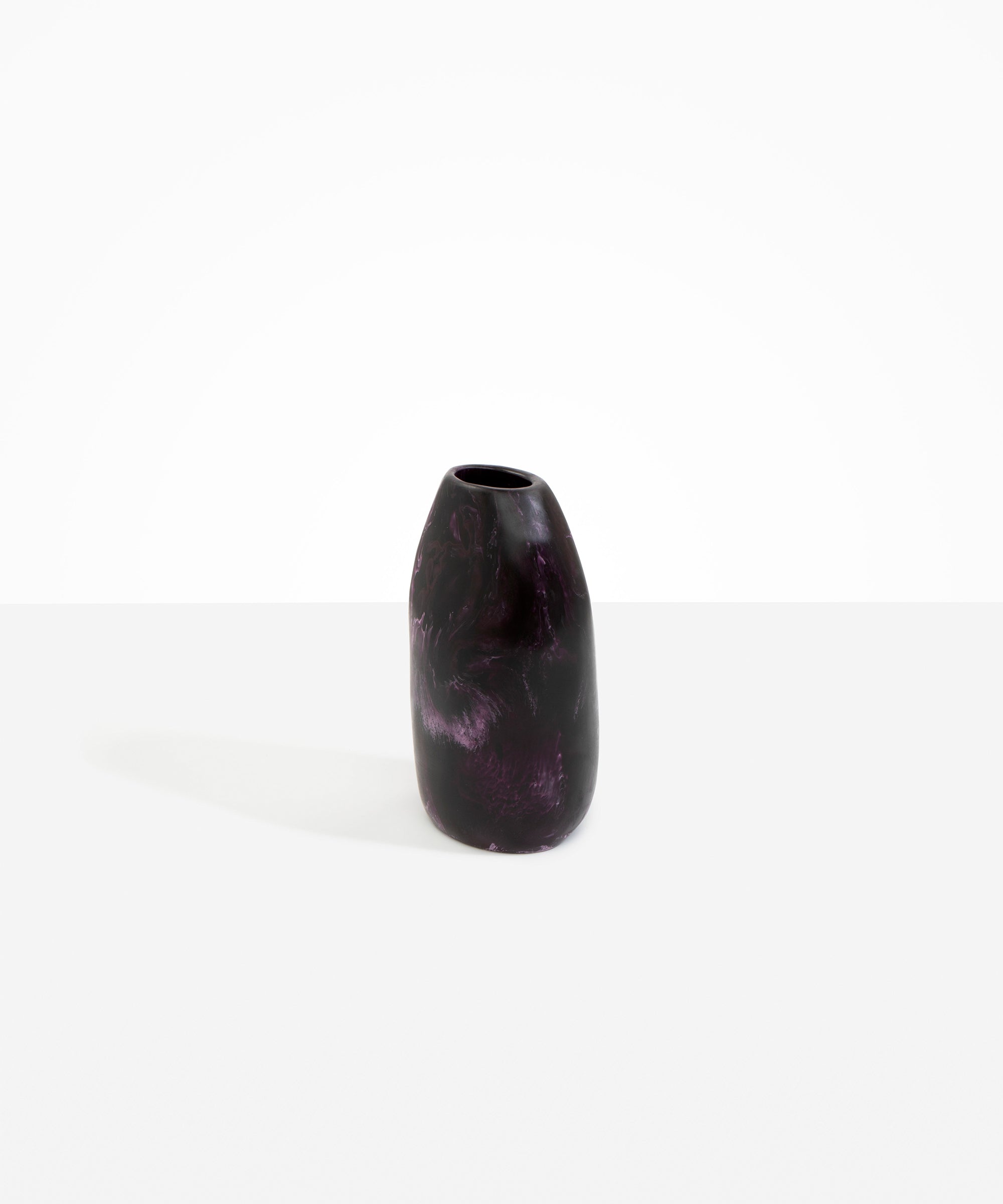 Dinosaur Designs Medium Pebble Vase in Dark Plum — handcrafted marbled dark purple and lilac resin vase with smooth rounded pebble form and narrow opening