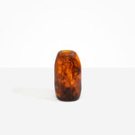 Dinosaur Designs Medium Pebble Vase in Tortoise — handcrafted marbled amber and black resin vase with smooth rounded pebble form and narrow opening