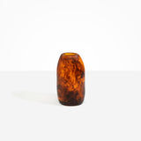 Dinosaur Designs Medium Pebble Vase in Tortoise — handcrafted marbled amber and black resin vase with smooth rounded pebble form and narrow opening