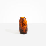 Dinosaur Designs Medium Pebble Vase in Tortoise — handcrafted marbled amber and black resin vase with smooth rounded pebble form and narrow opening