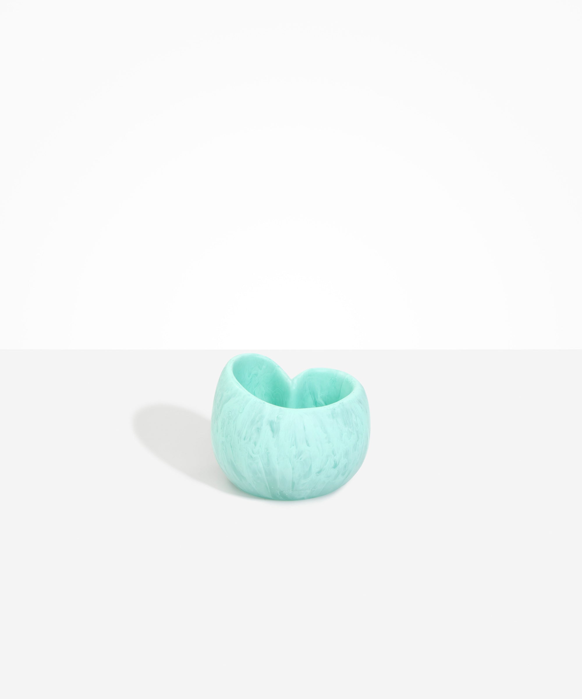 Dinosaur Designs Orchid Vase in Mint — handcrafted marbled mint blue resin vase with short rounded organic form and sculpted open petal-shaped rim