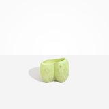 Dinosaur Designs Orchid Vase in Pistachio — handcrafted marbled pastel green resin vase with short rounded organic form and sculpted open petal-shaped rim