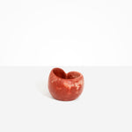 Dinosaur Designs Orchid Vase in Rust — handcrafted marbled terracotta red and cream resin vase with short rounded organic form and sculpted open petal-shaped rim