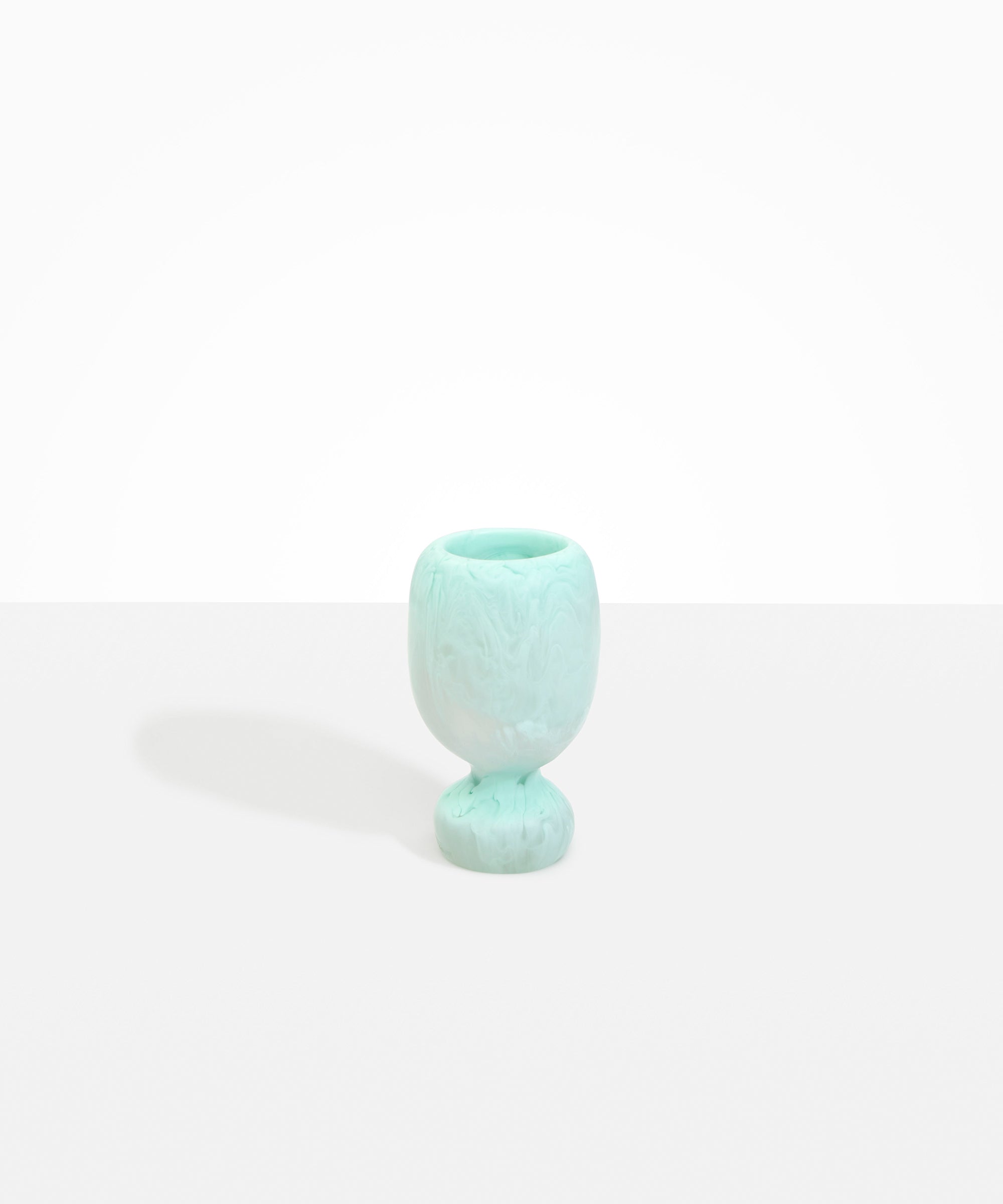 Dinosaur Designs Small Rockpool Vase in Mint — handcrafted marbled mint blue resin vase with rounded bulbous body and small spherical pedestal base