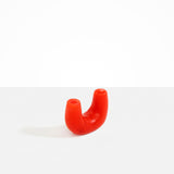 Dinosaur Designs Mini Branch Vase in Poppy —  marbled red resin decorative vase with chunky U-shaped arch form and twin openings