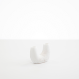 Dinosaur Designs Mini Branch Vase in Snow Swirl —  marbled white resin decorative vase with chunky U-shaped arch form and twin openings