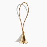 Dinosaur Designs Metal Flower Wind Chime in Brass — polished brass cast flower-shaped decorative wind chime with tan leather hanging loop