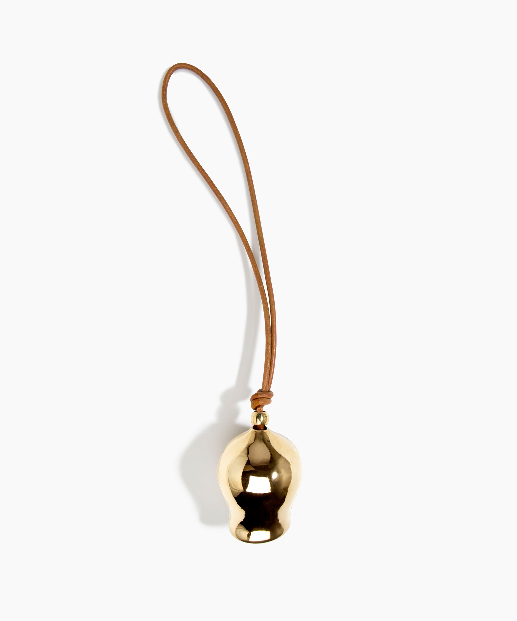 Dinosaur Designs Metal Gumnut Wind Chime in Brass — polished brass cast gumnut-shaped decorative wind chime with tan leather hanging loop