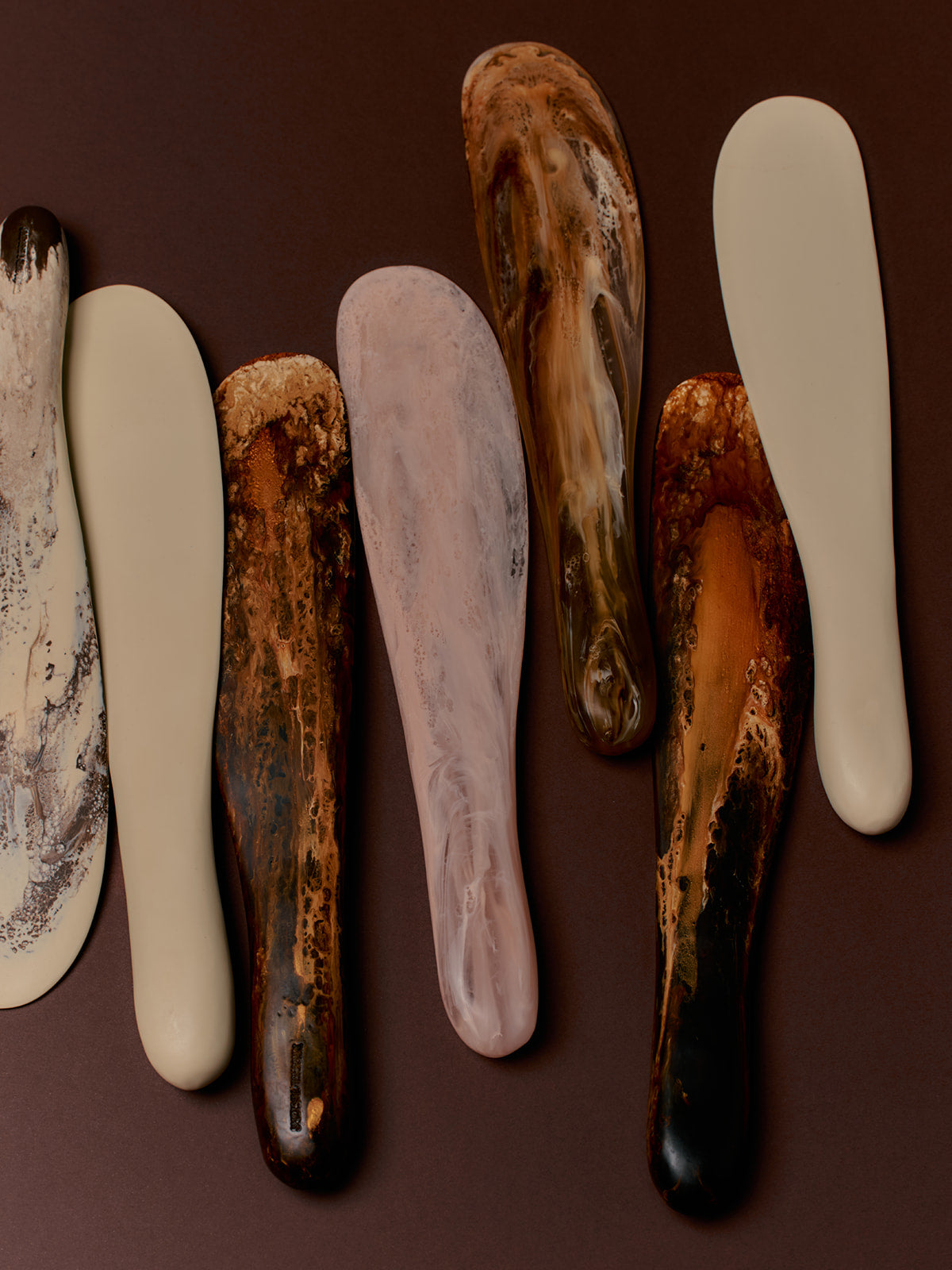 Dinosaur Designs Temple cake knife server in brown, cream and pink marbled resin