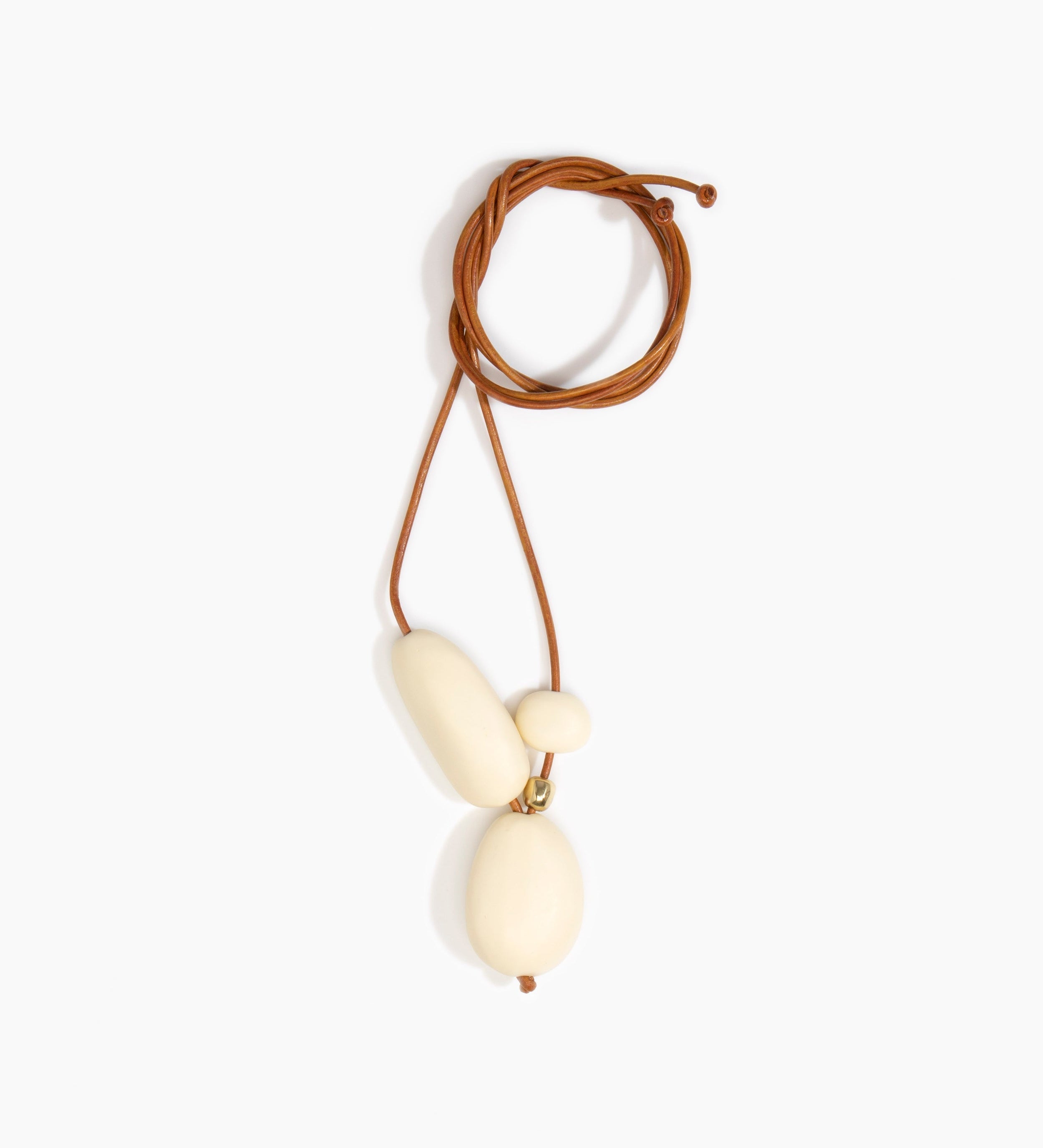 Dinosaur Designs Rock Cluster Pendant Necklaces in Cream Colour resin with Nano-Coated Brass Bead Material