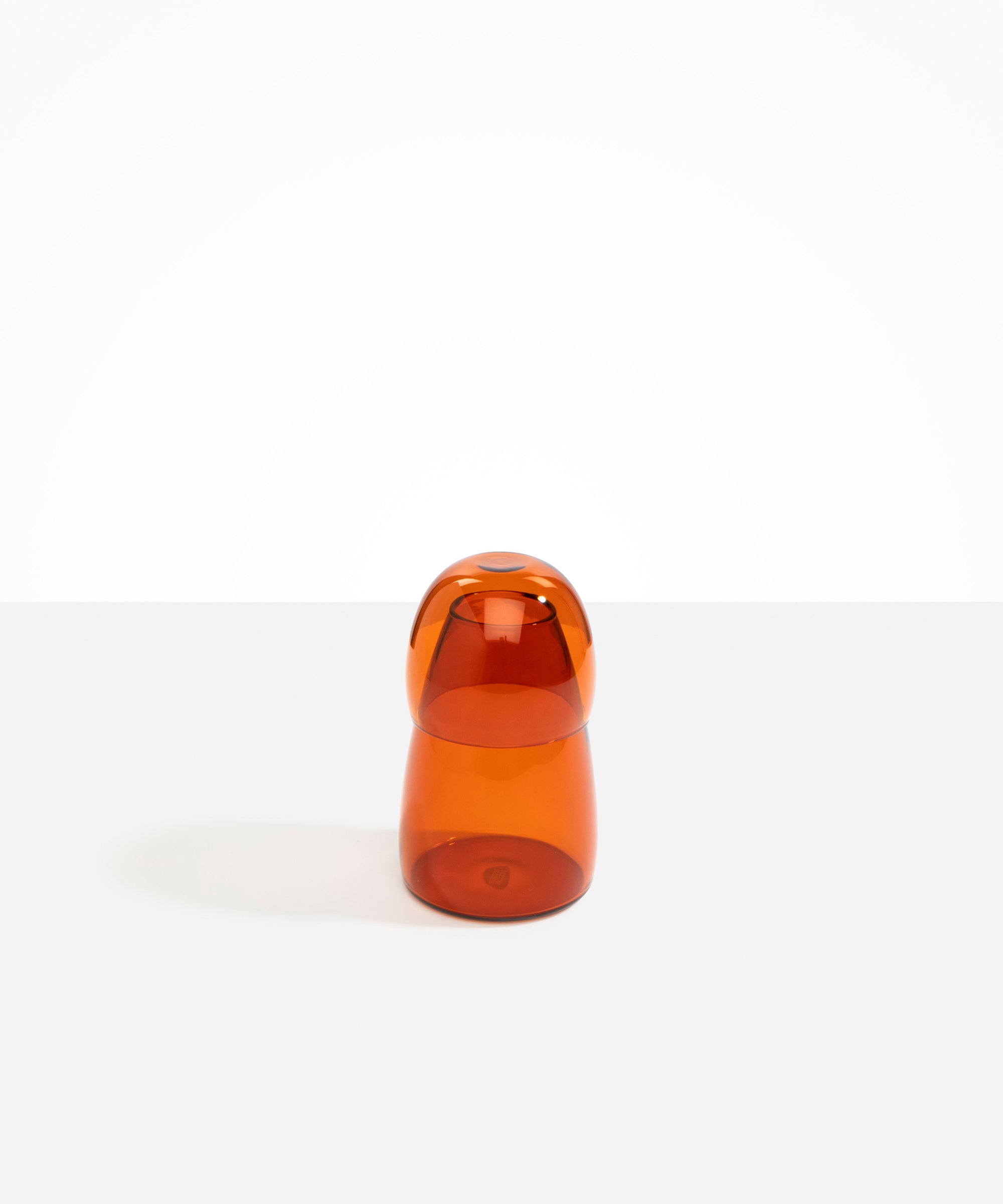 Dinosaur Designs coloured Glass Pebble Carafe cup and jug set in amber orange..