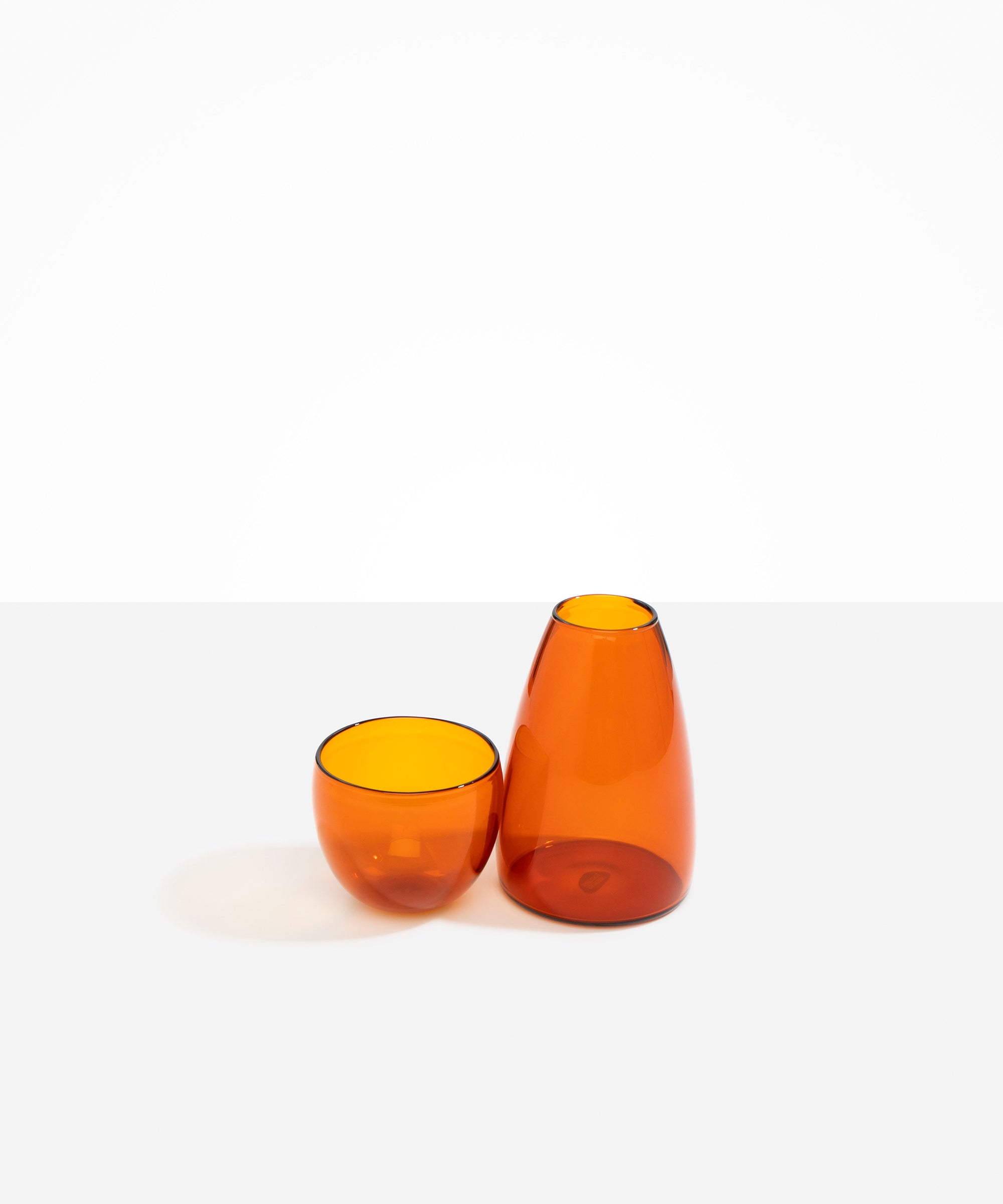 Dinosaur Designs Glass Pebble Carafe in Amber Colour resin..