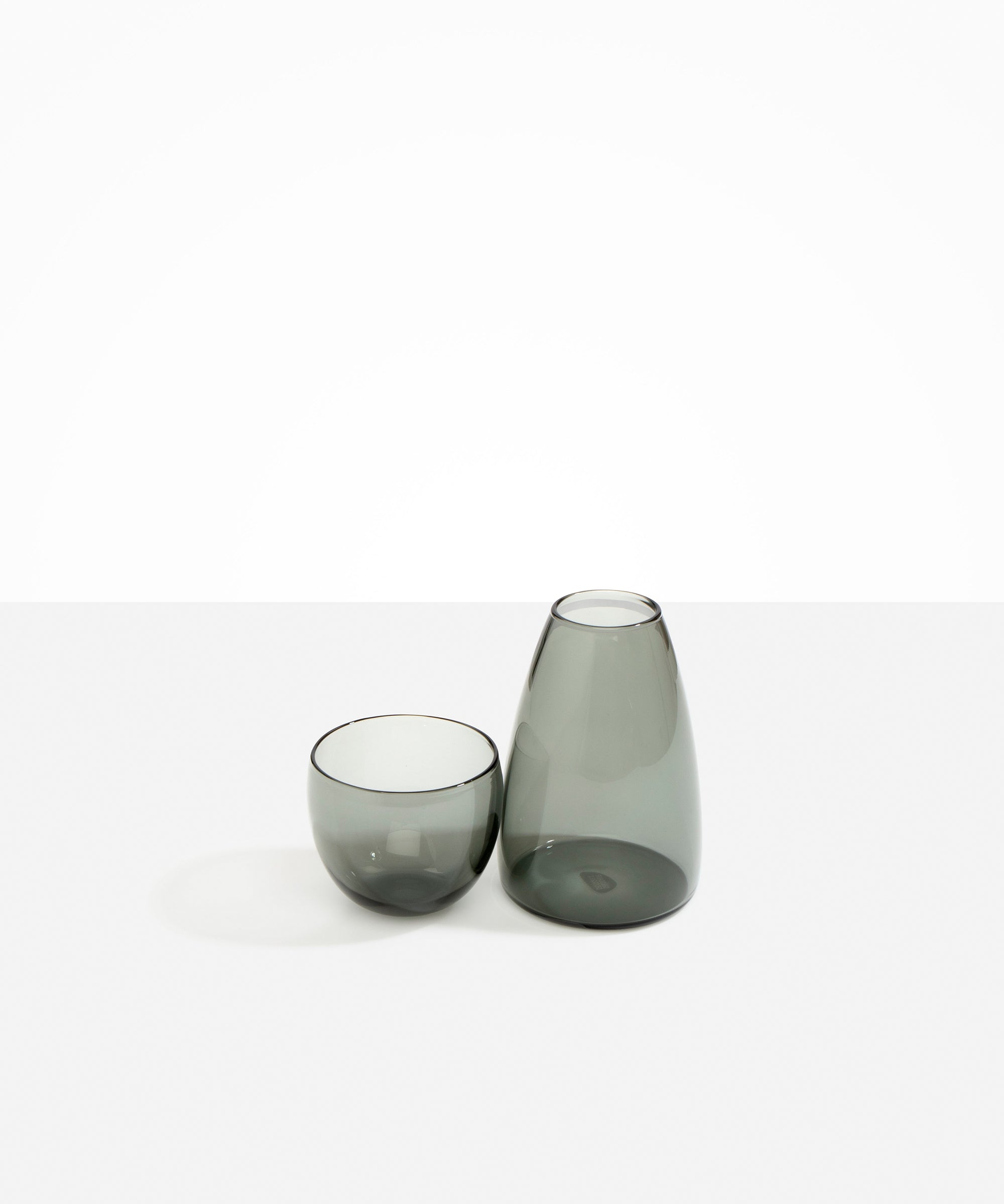 Dinosaur Designs Glass Pebble Carafe in Clear Black Colour resin..