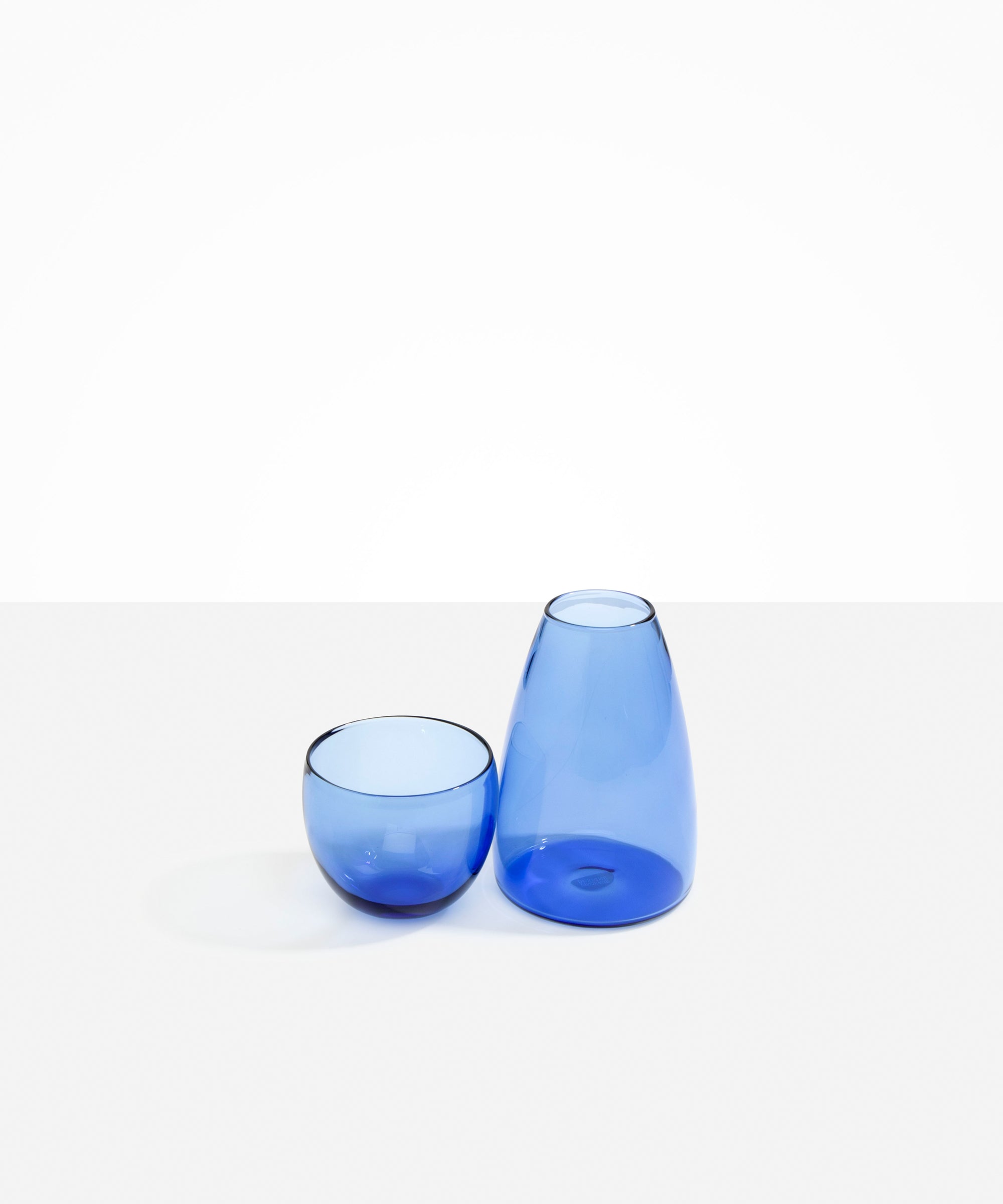 Dinosaur Designs Glass Pebble Carafe in Light Blue Colour resin..