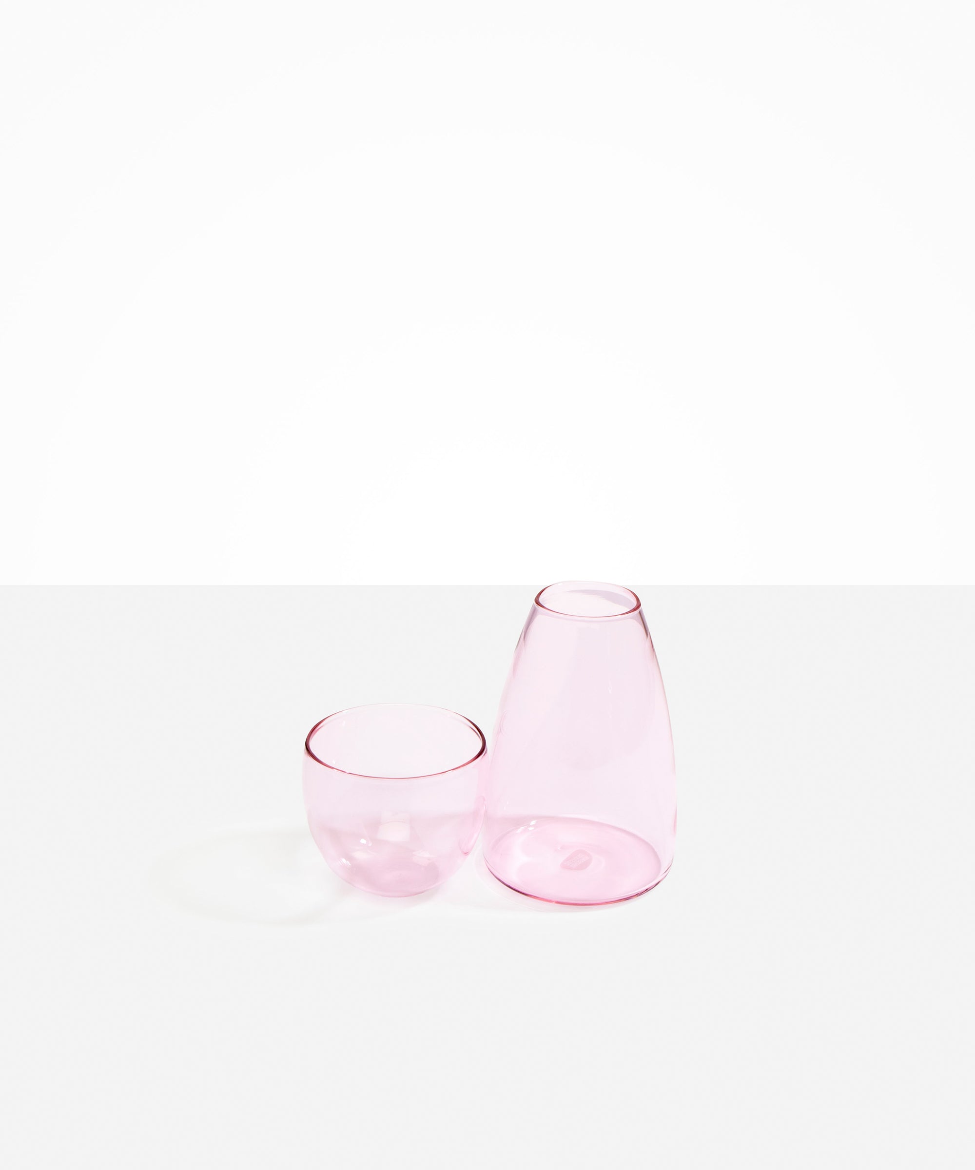 Dinosaur Designs Glass Pebble Carafe in Pink Colour resin..