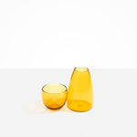 Dinosaur Designs Glass Pebble Carafe in Yellow Colour resin..