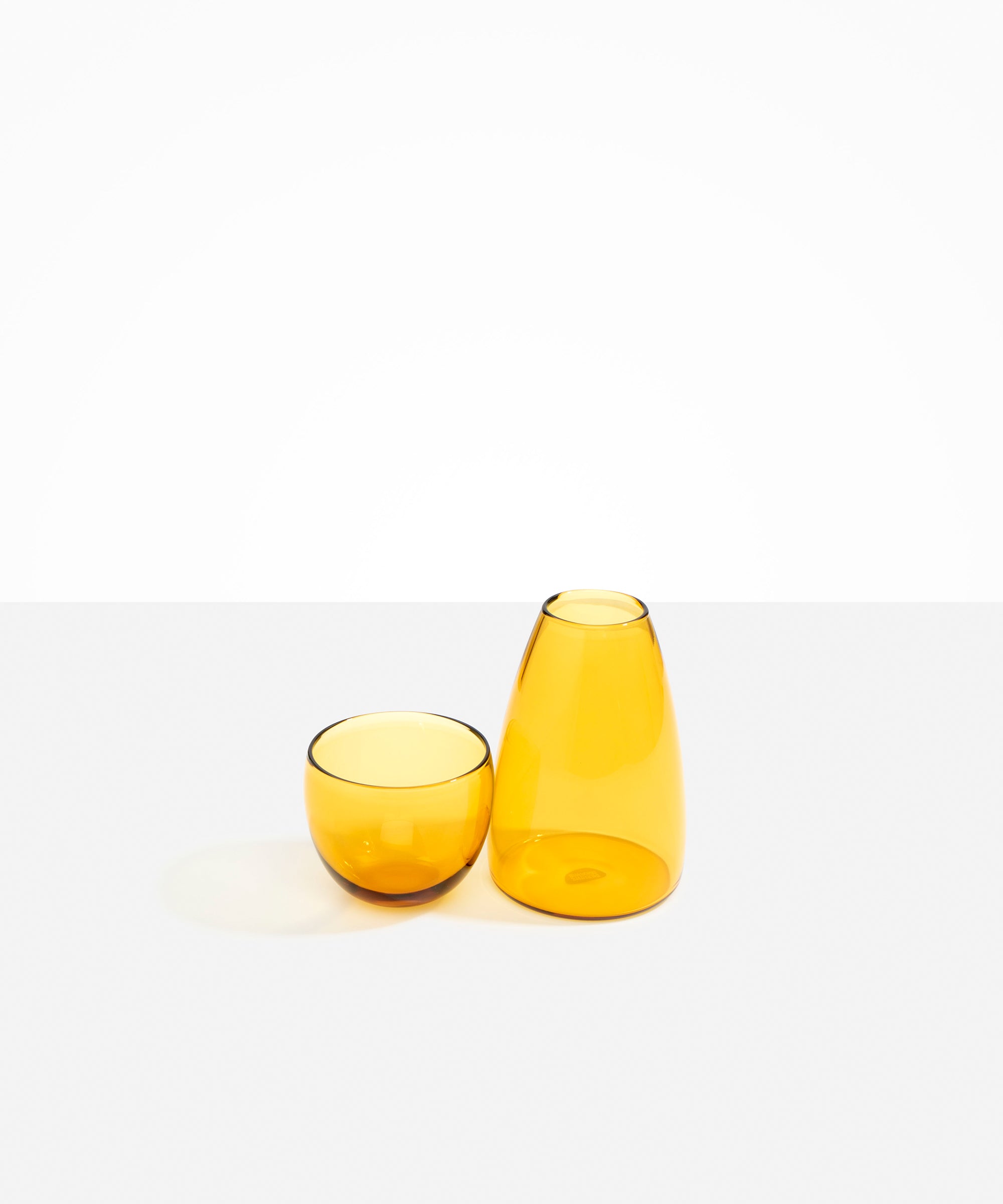 Dinosaur Designs Glass Pebble Carafe in Yellow Colour resin..