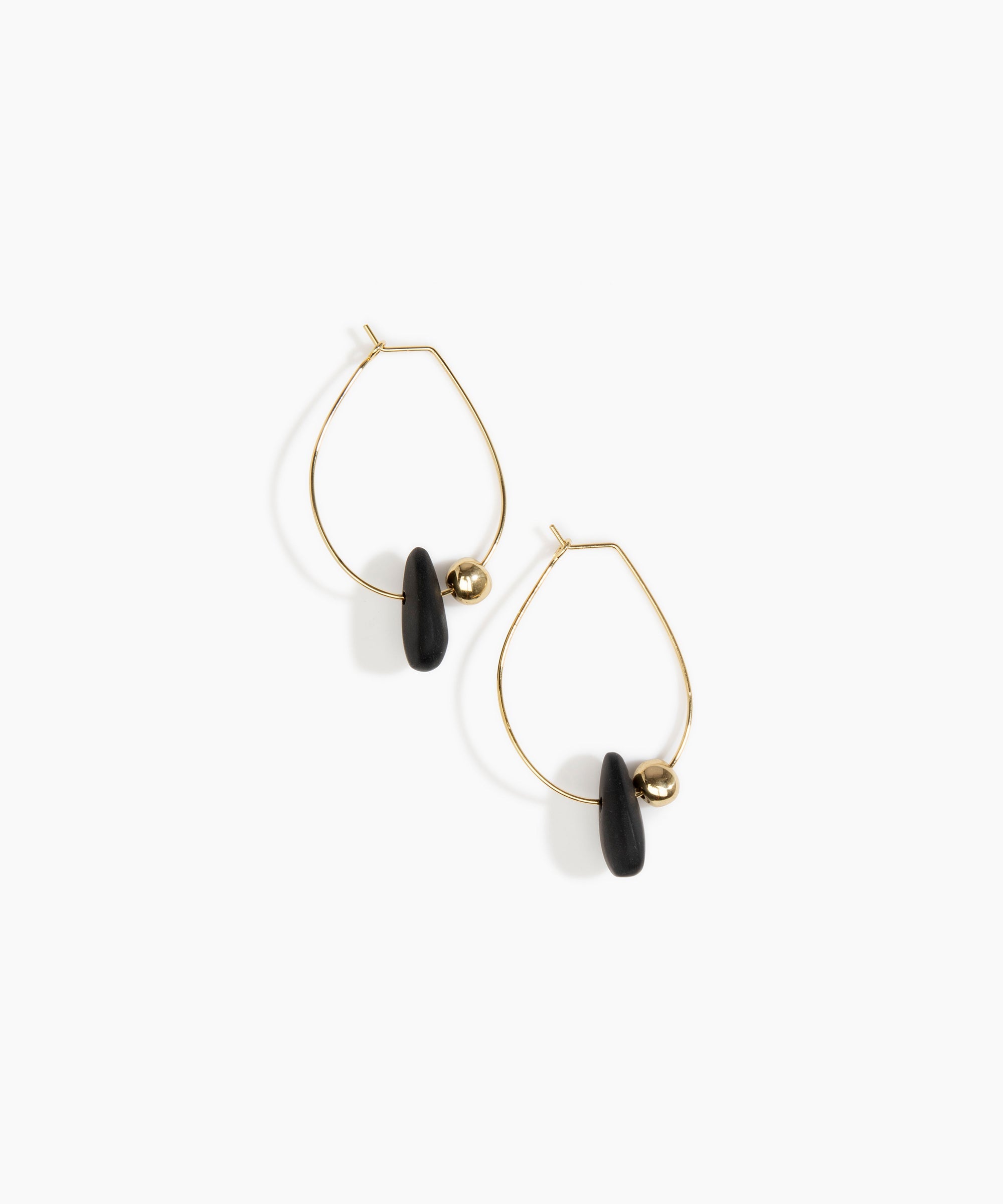Dinosaur Designs Joie De Vivre Hoop Earrings in Black Colour resin with Gold-Filled Material.