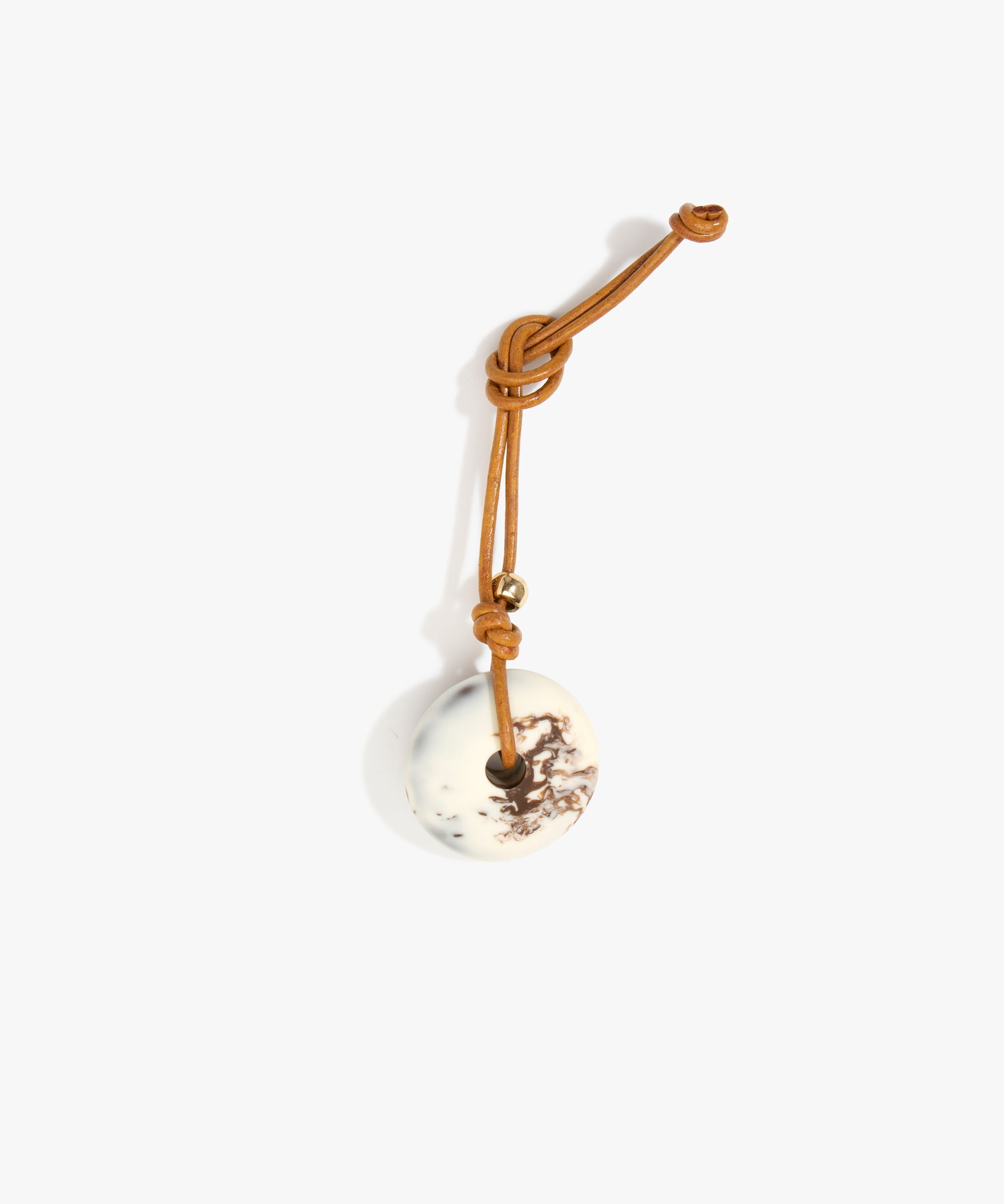 Dinosaur Designs Flat Watercolour Bag Charm in Cappuccino Colour resin with Brass Material.