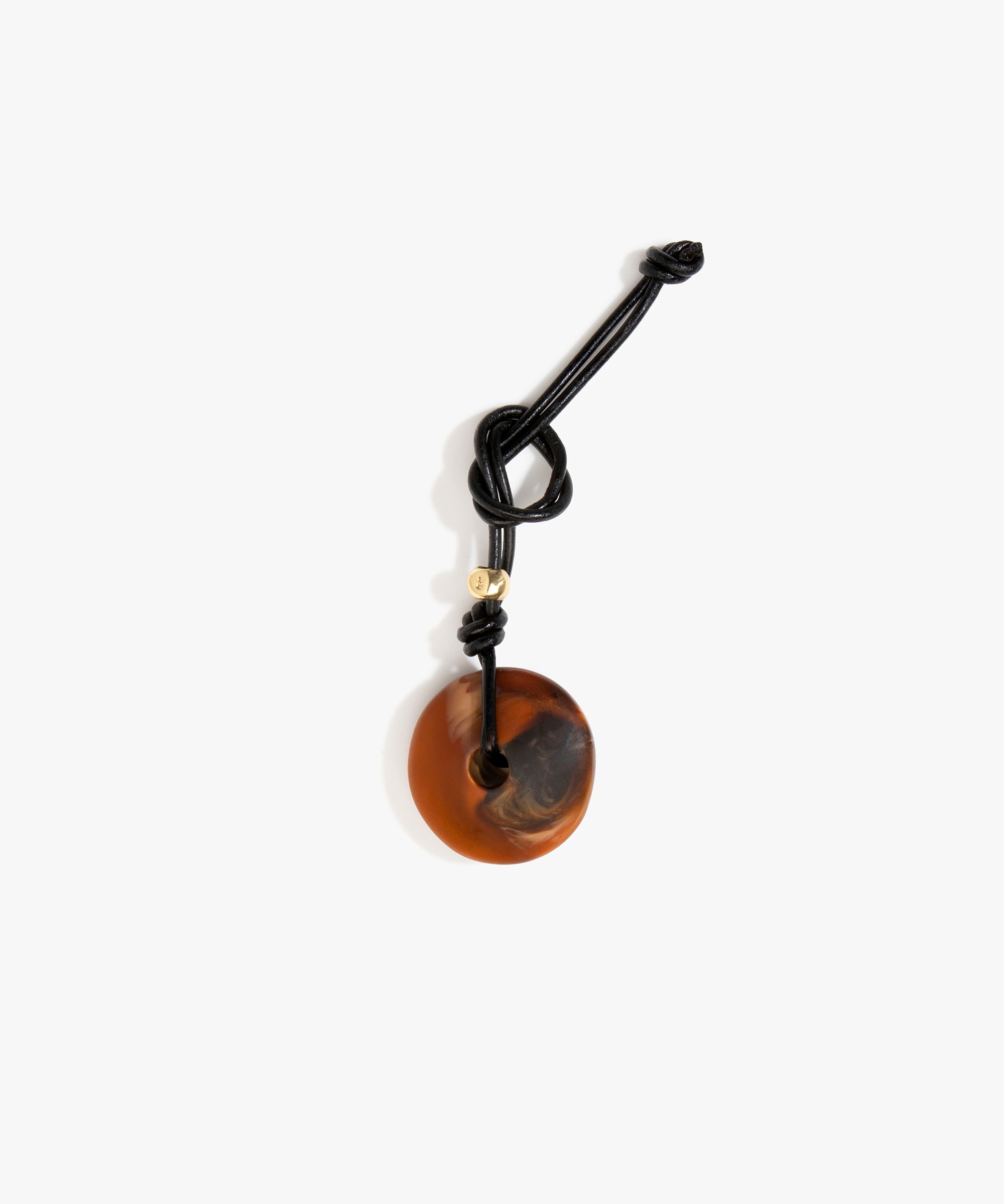 Dinosaur Designs Flat Watercolour Bag Charm in Dark Horn Colour resin with Brass Material.