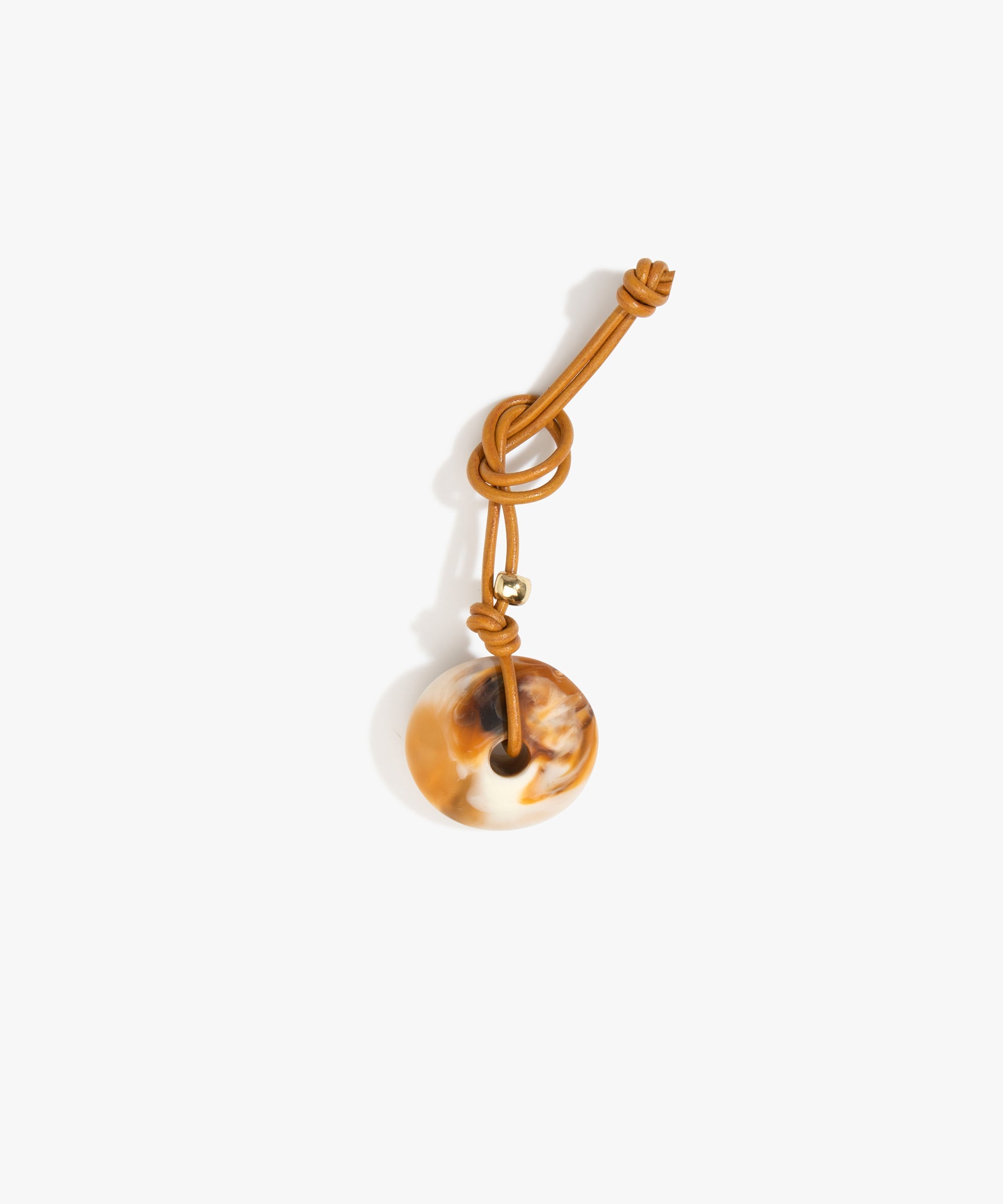 Dinosaur Designs Flat Watercolour Bag Charm in Light Horn Colour resin with Brass Material.