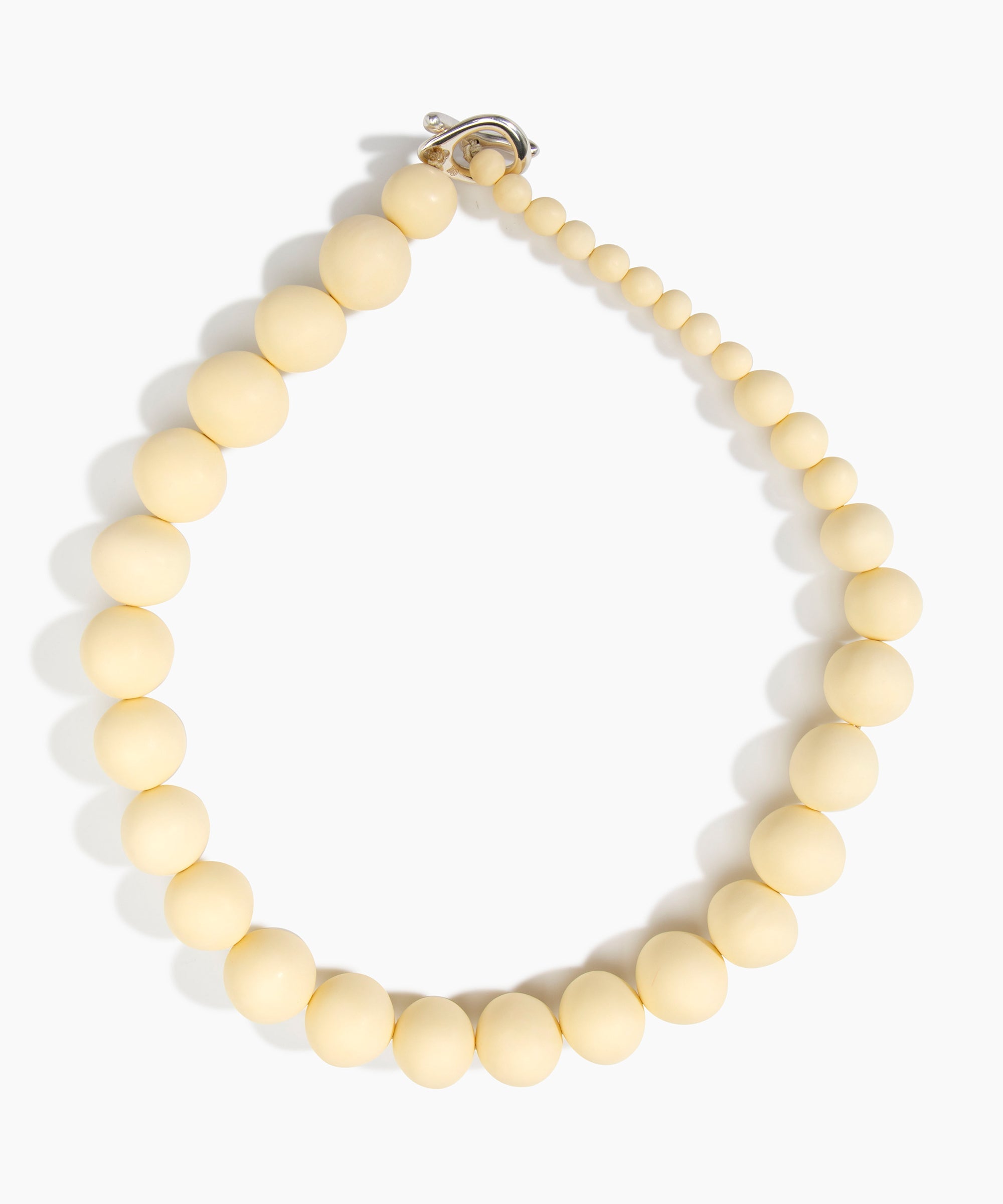 Dinosaur Designs Organic Ball Necklace in Cream — handcrafted resin graduating bead necklace with silver-plated t-bar clasp