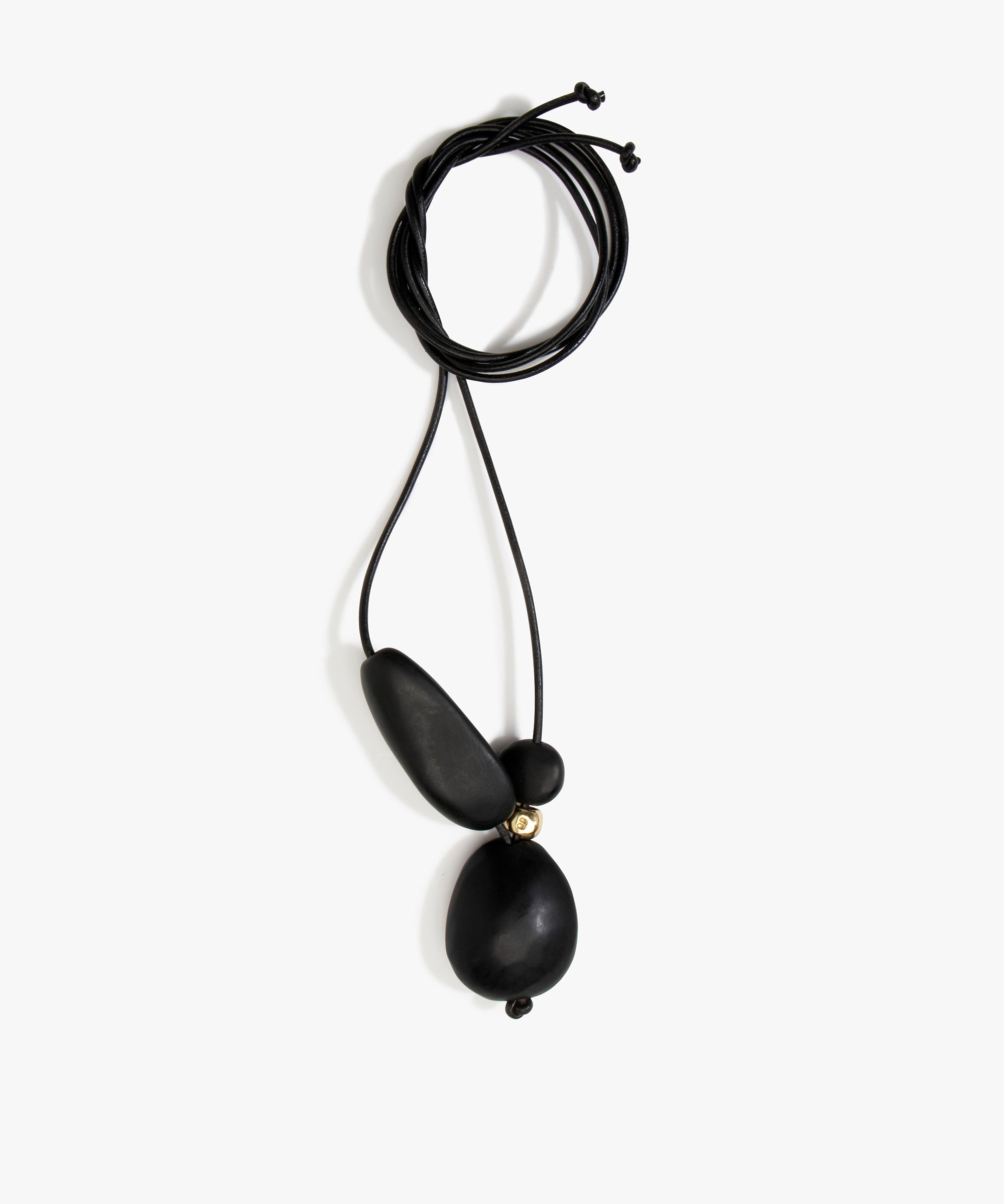 Dinosaur Designs Rock Cluster Pendant in Black Colour resin with Nano-Coated Brass Bead Material.