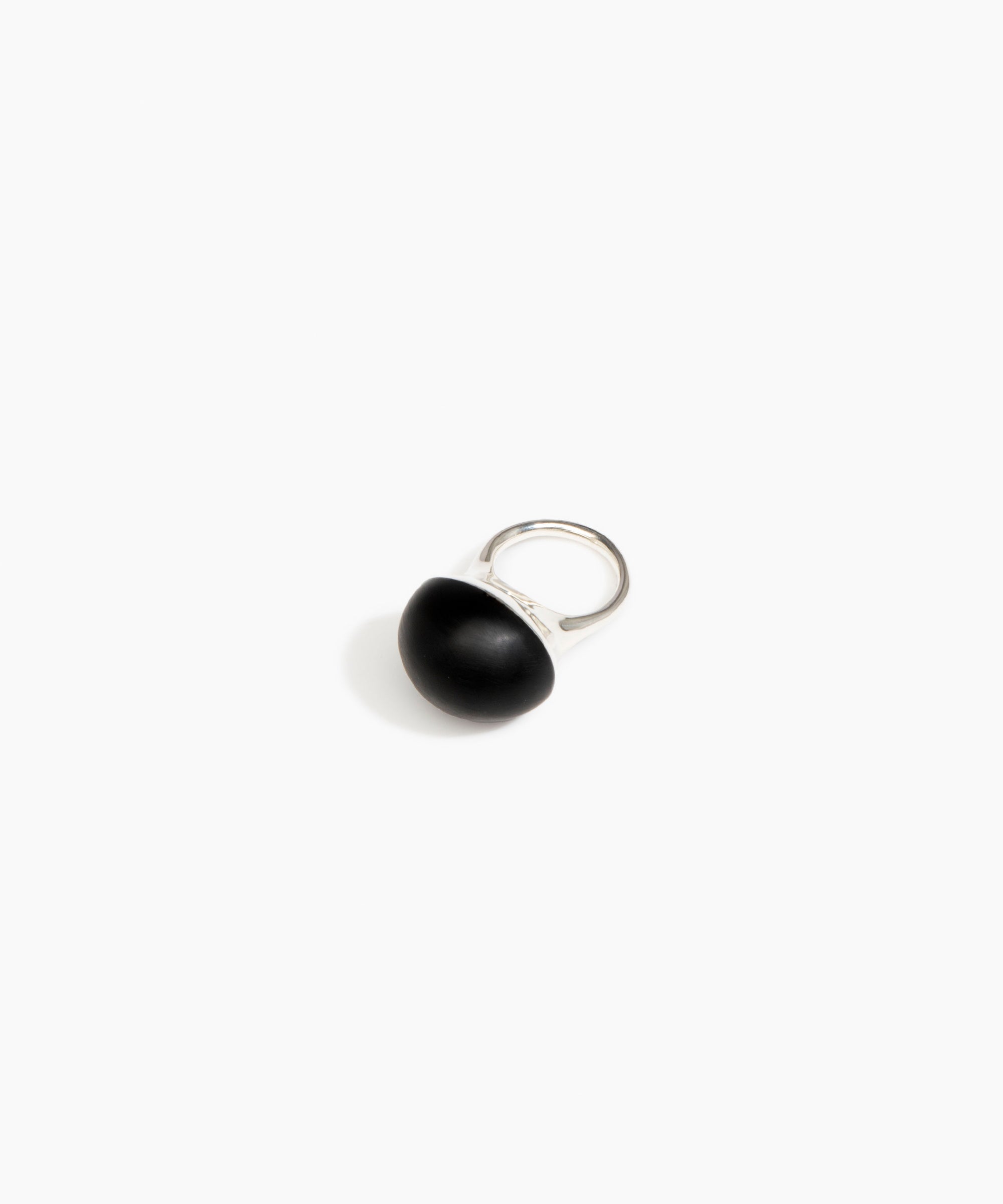 Black ring with a silver band on a white background